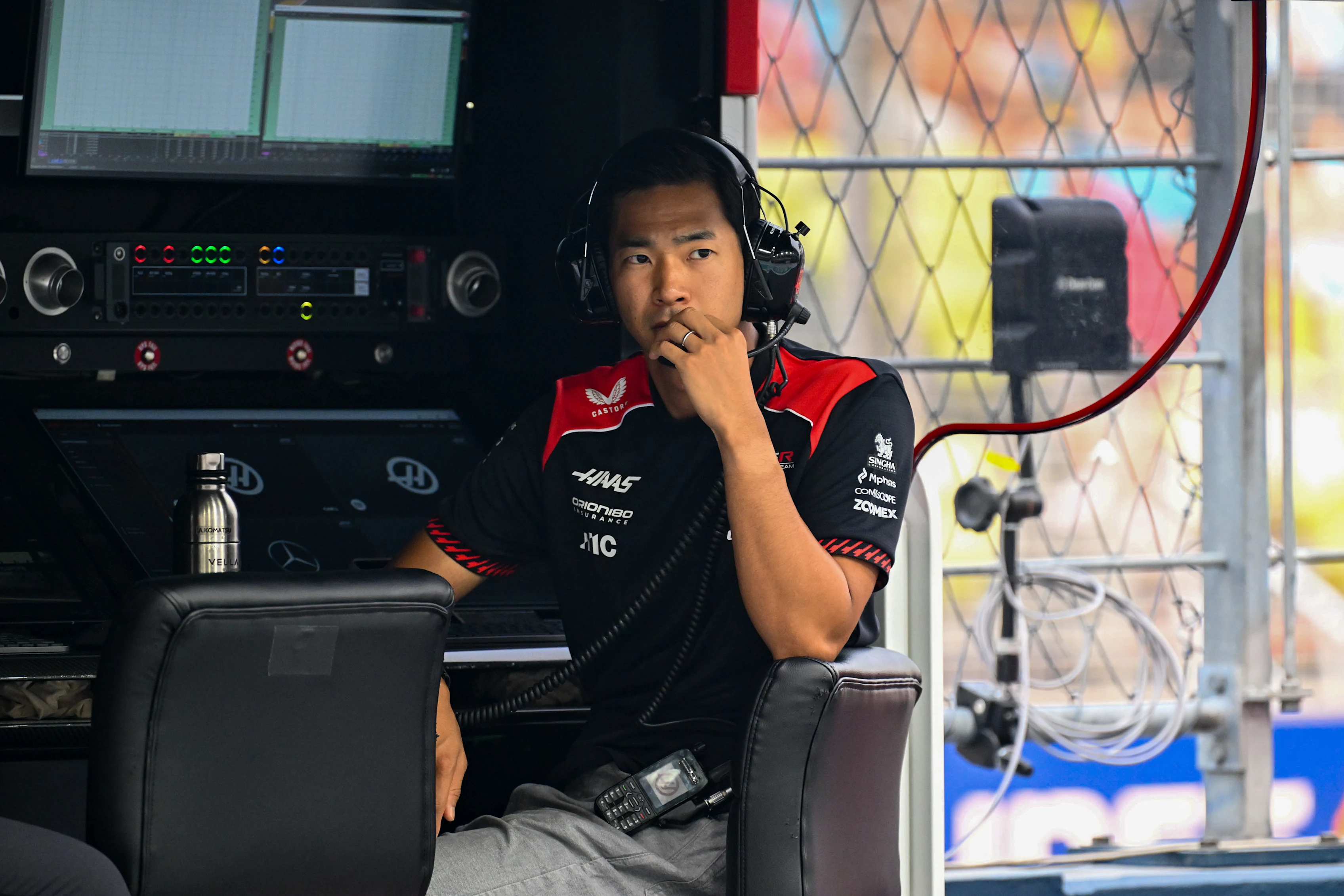 SINGAPORE, SINGAPORE - OCTOBER 09: Ryo Hirakawa of Japan and Haas F1 looks on from the pit wall
