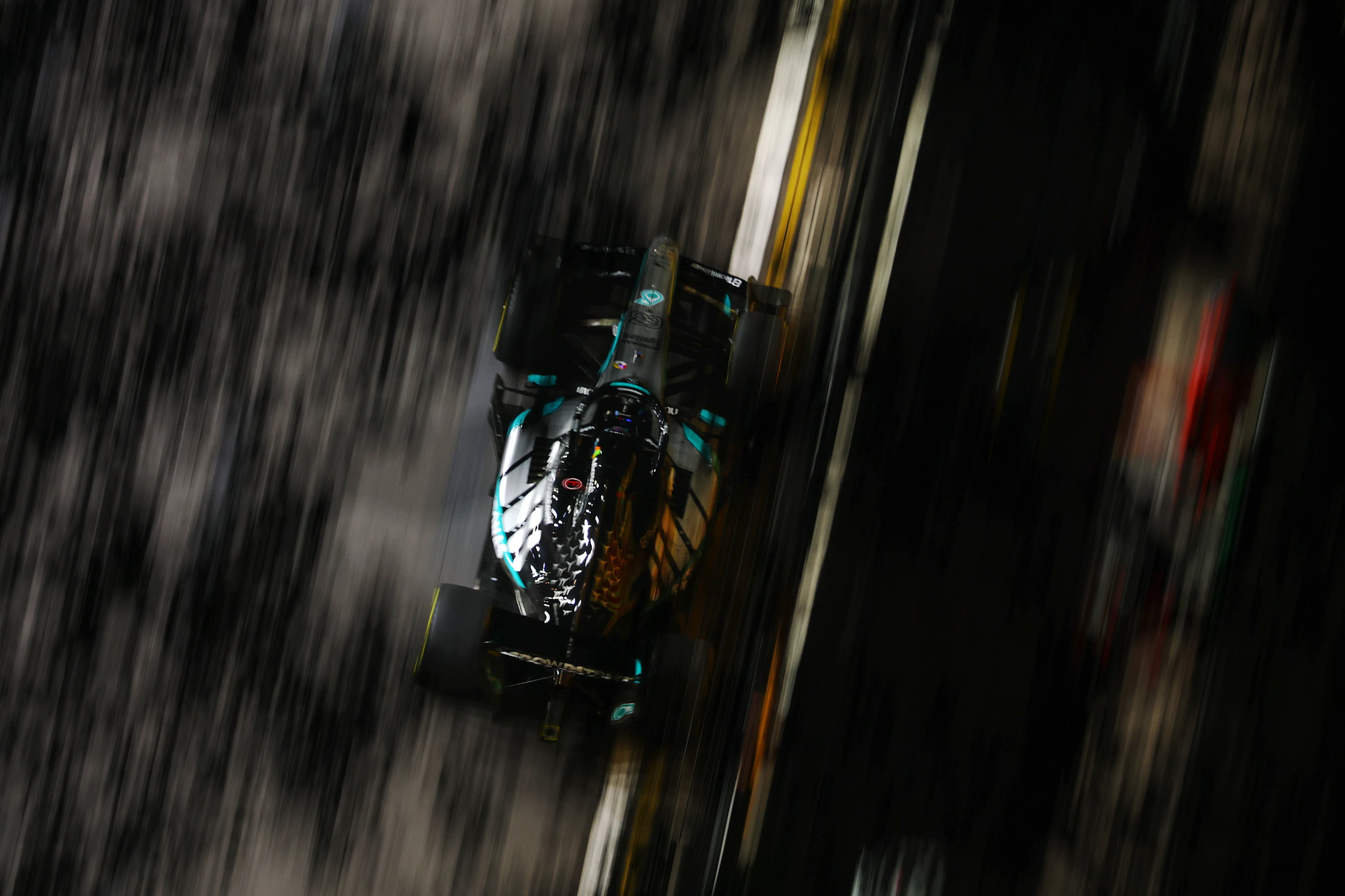 SINGAPORE, SINGAPORE - OCTOBER 09: George Russell of Great Britain driving the (63) Mercedes AMG
