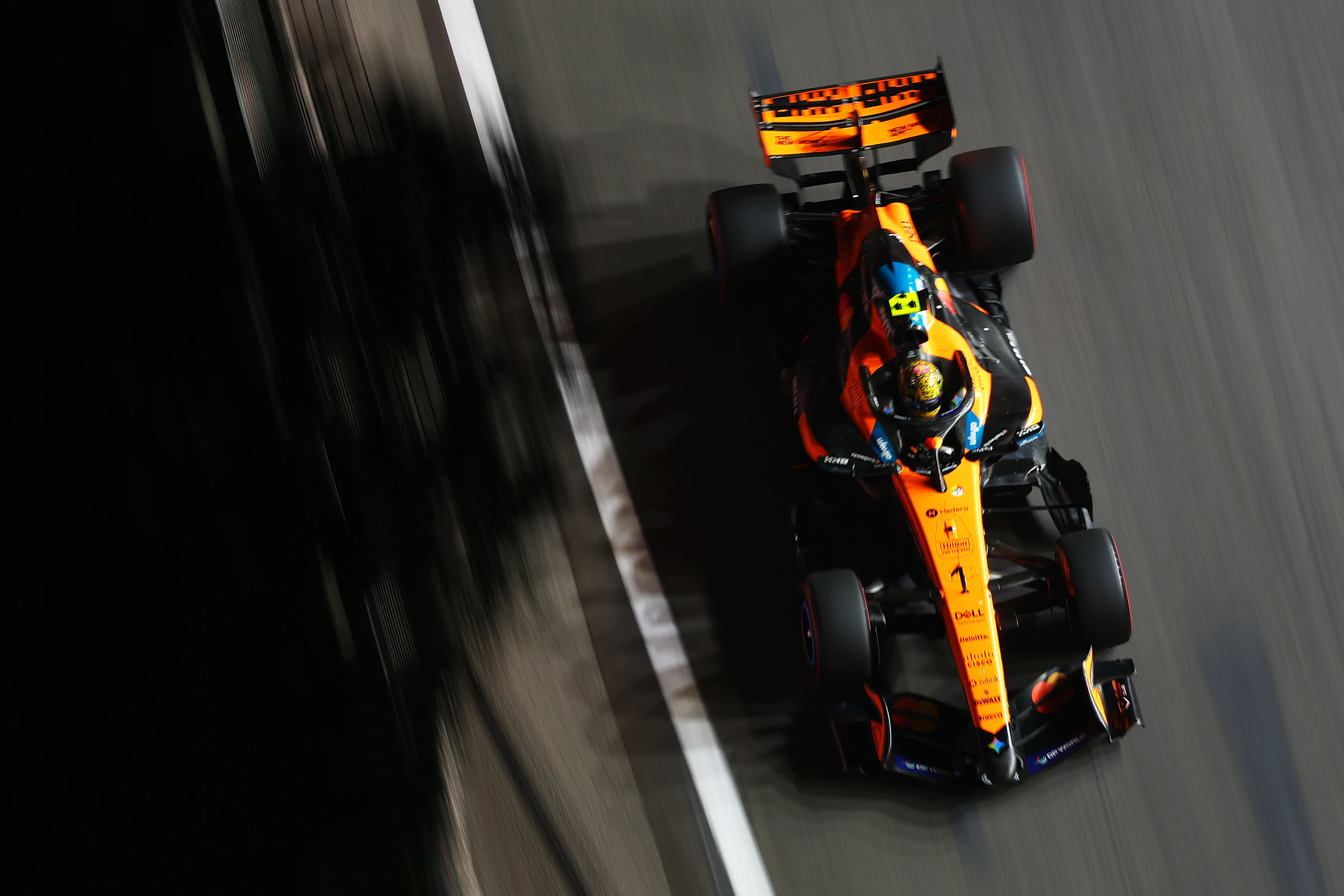 SINGAPORE, SINGAPORE - OCTOBER 09: Lando Norris of Great Britain driving the (1) McLaren MCL40