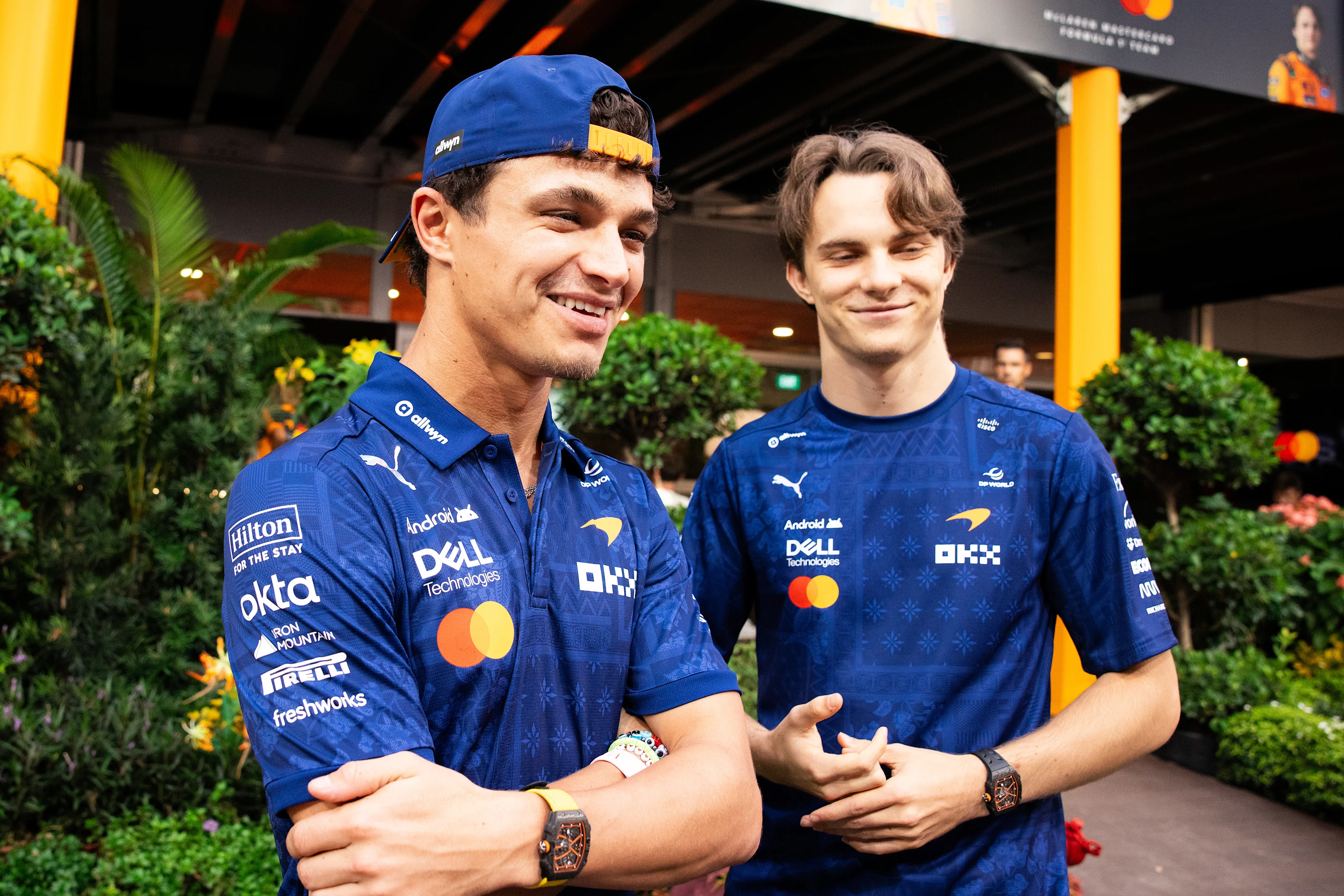 SINGAPORE, SINGAPORE - OCTOBER 08: Lando Norris of Great Britain and McLaren and Oscar Piastri of