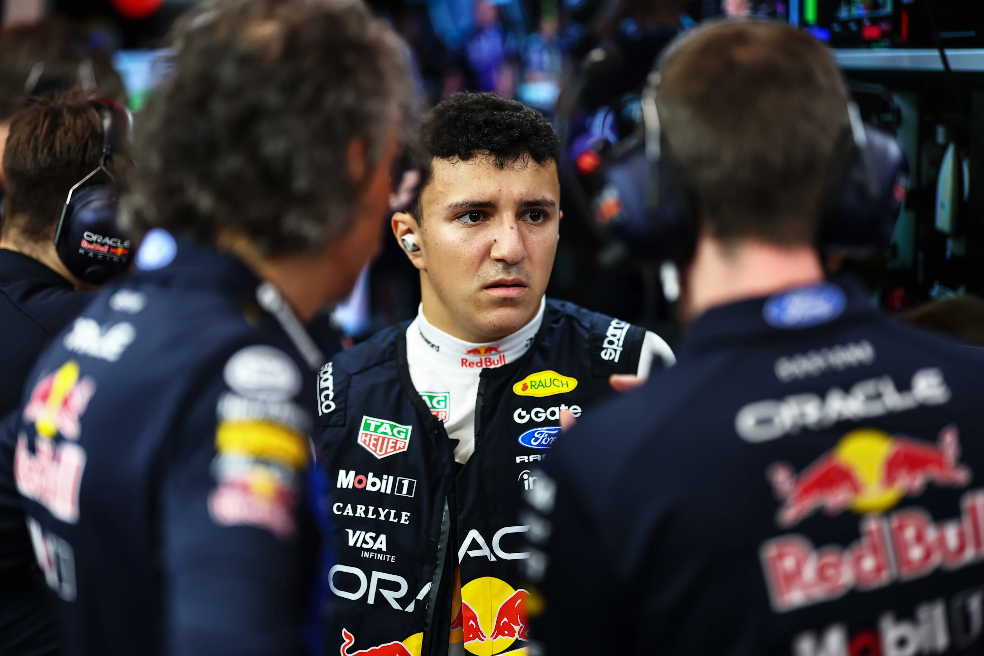 SINGAPORE, SINGAPORE - OCTOBER 10: Isack Hadjar of France and Oracle Red Bull Racing talks with