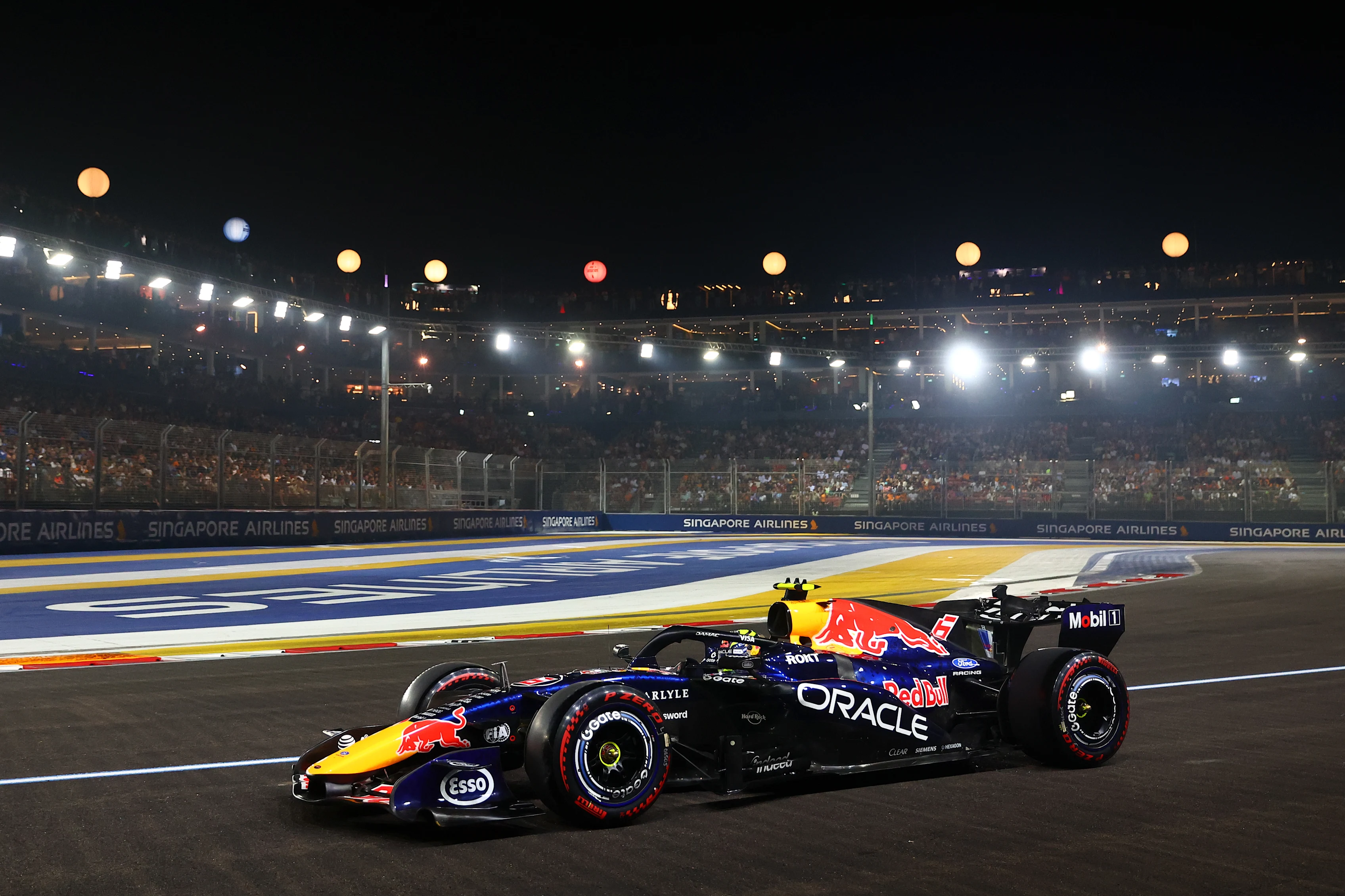 SINGAPORE, SINGAPORE - OCTOBER 10: Isack Hadjar of France driving the (6) Oracle Red Bull Racing