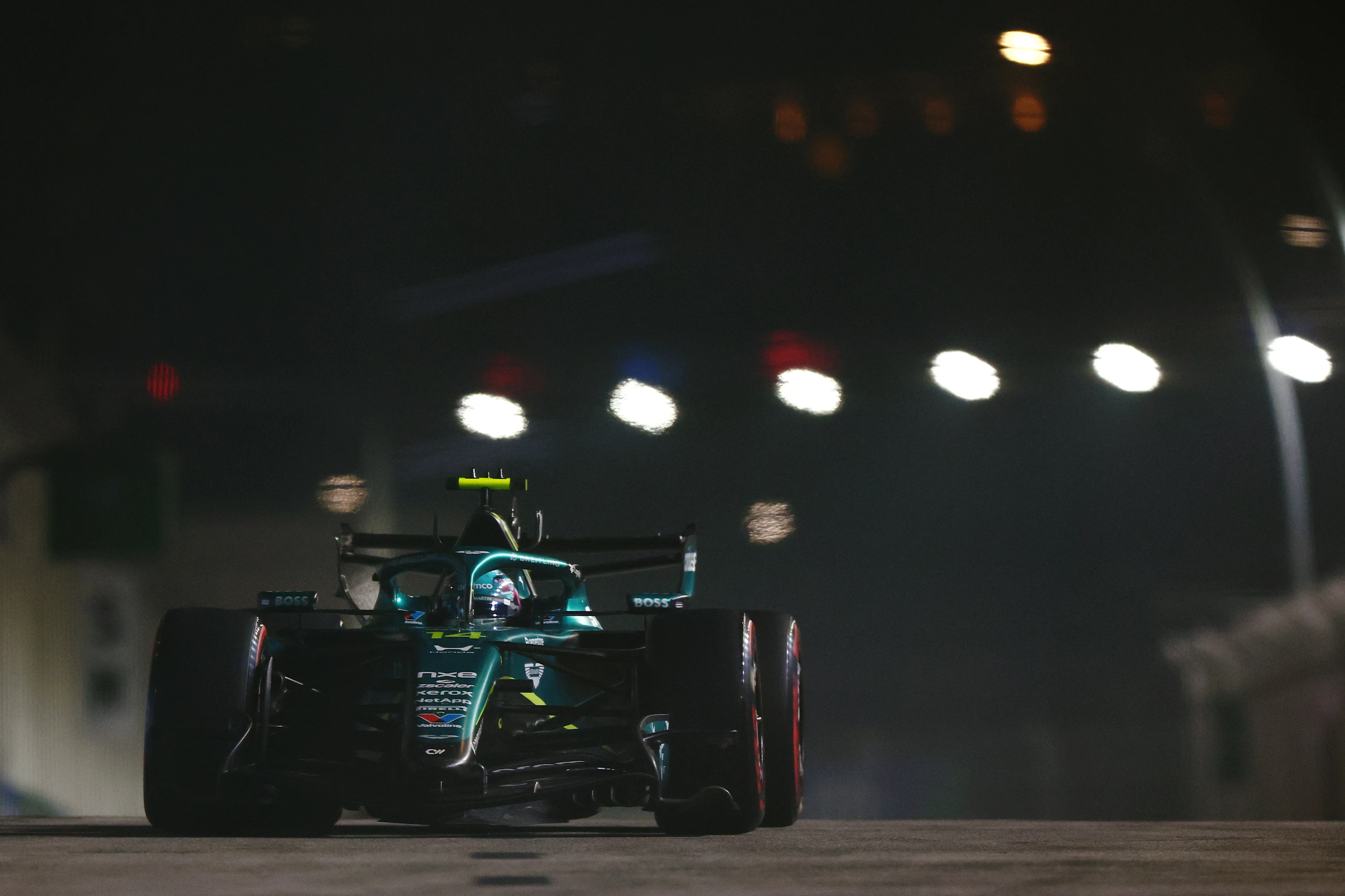 SINGAPORE, SINGAPORE - OCTOBER 10: Fernando Alonso of Spain driving the (14) Aston Martin F1 Team