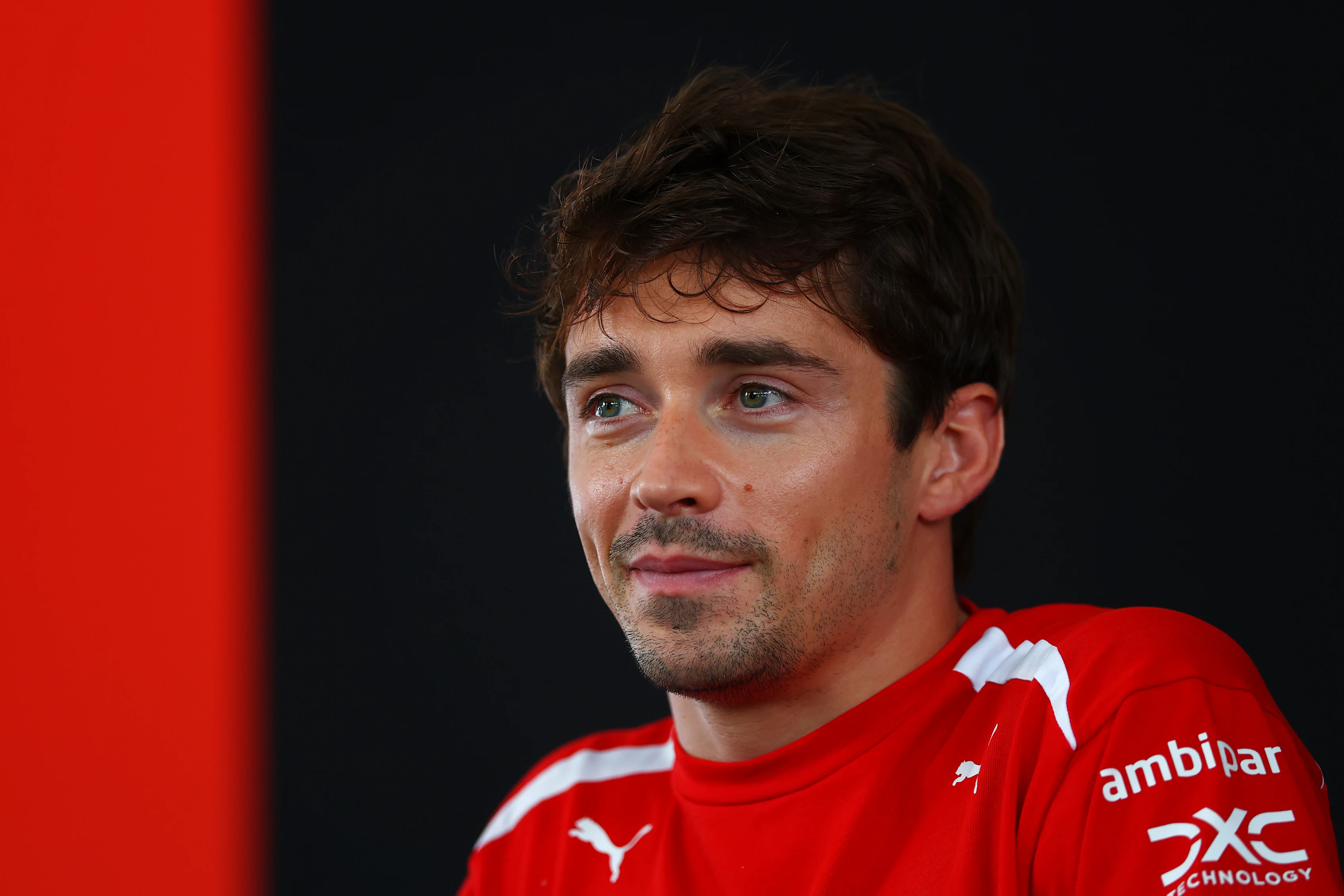 KUALA LUMPUR, MALAYSIA - OCTOBER 01: Charles Leclerc of Monaco and Scuderia Ferrari talks to the