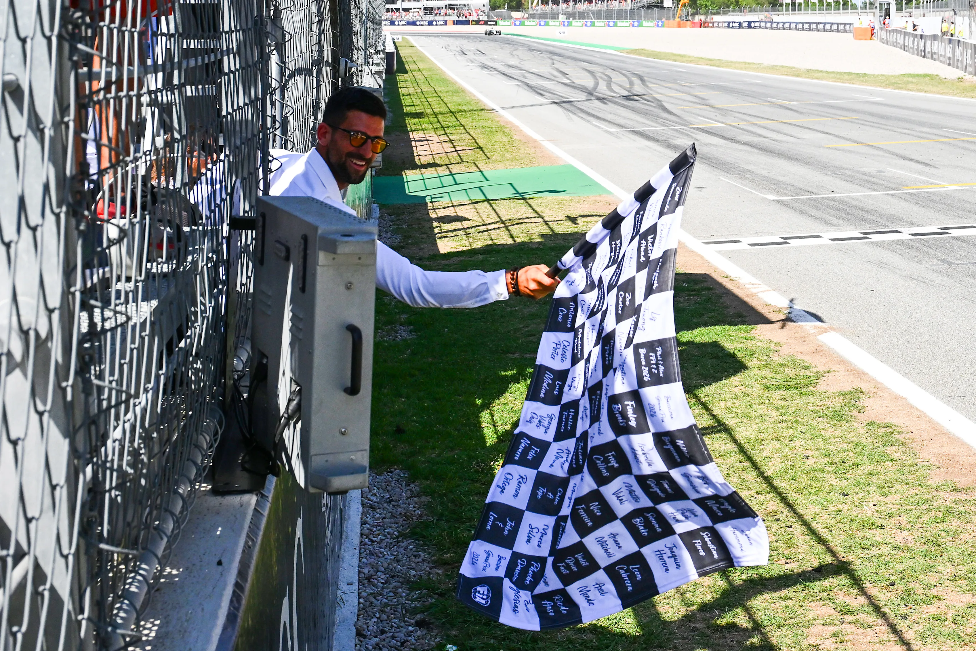BARCELONA, SPAIN - JUNE 14: Novak Djokovic waves the chequered flag during the F1 Grand Prix of