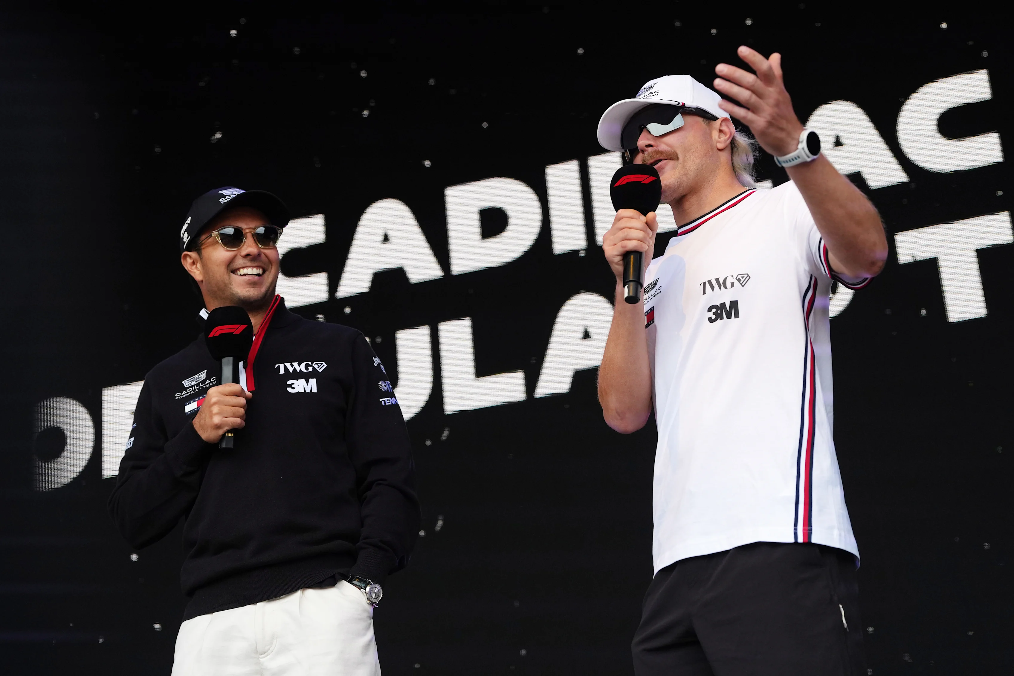 SPA, BELGIUM - JULY 18: Sergio Perez of Mexico and Cadillac F1 Team and Valtteri Bottas of Finland