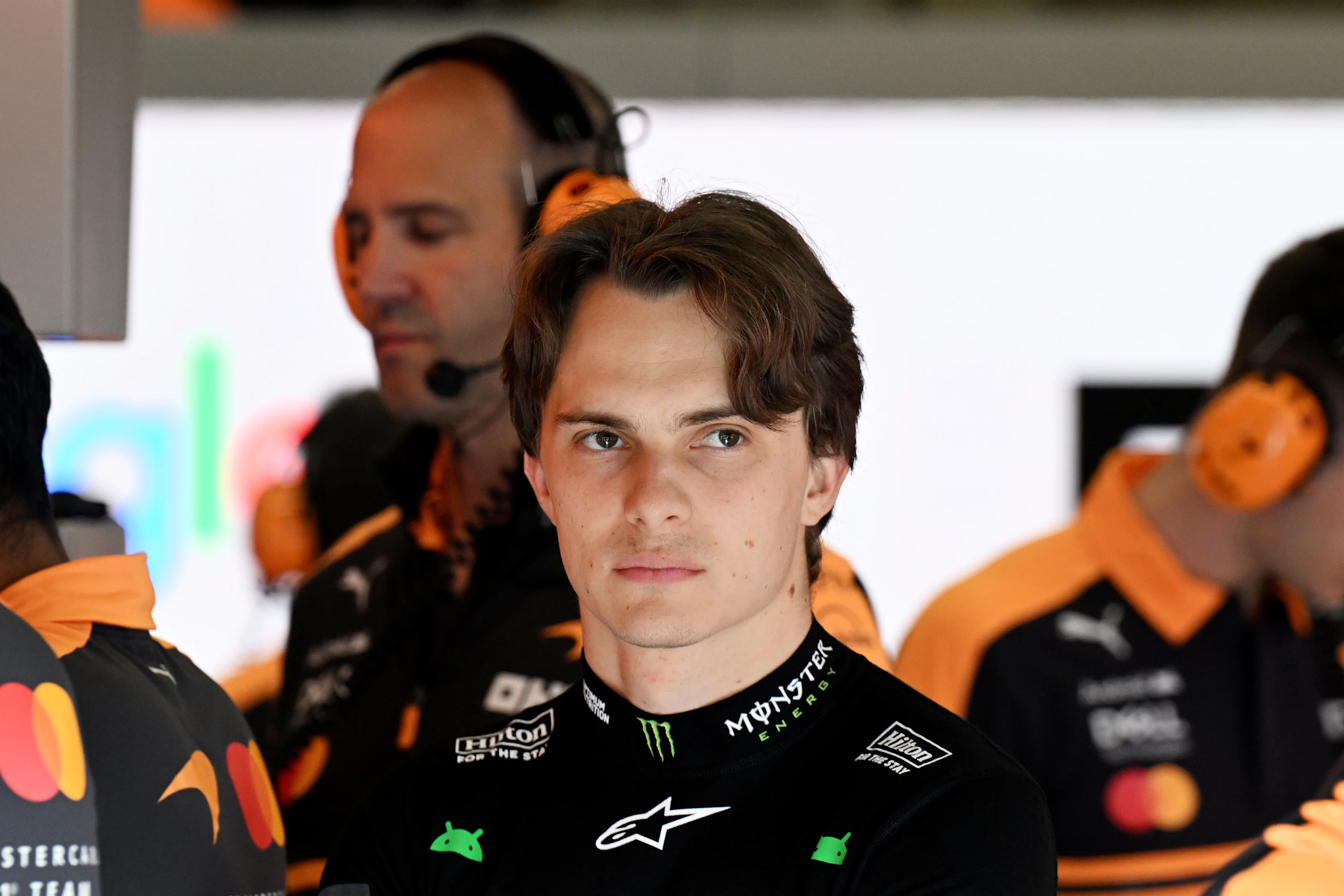 SPA, BELGIUM - JULY 18: Oscar Piastri of Australia and McLaren looks on in the garage during