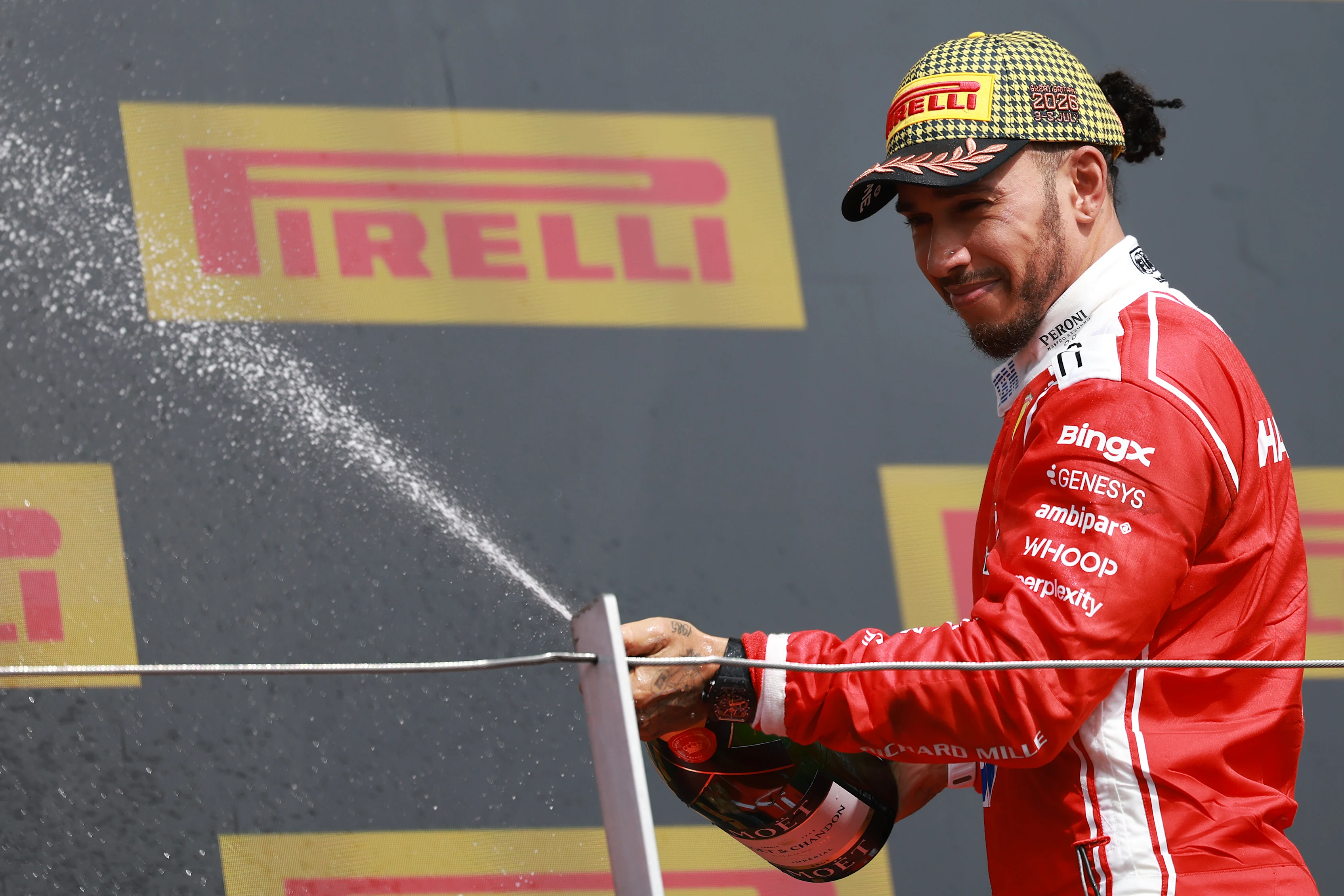 NORTHAMPTON, ENGLAND - JULY 05: Third placed Lewis Hamilton of Great Britain and Scuderia Ferrari