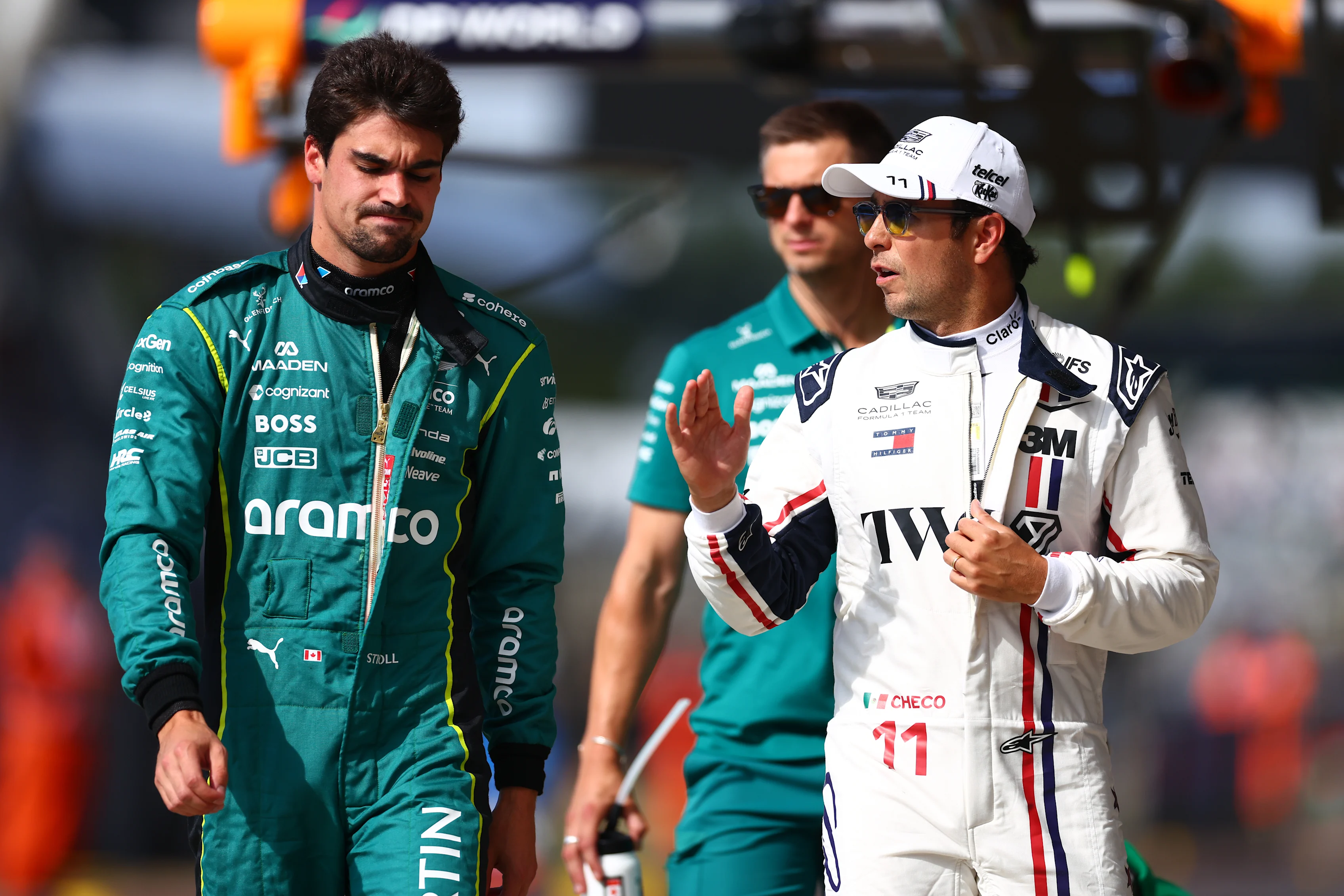 NORTHAMPTON, ENGLAND - JULY 03: Lance Stroll of Canada and Aston Martin F1 Team and Sergio Perez of