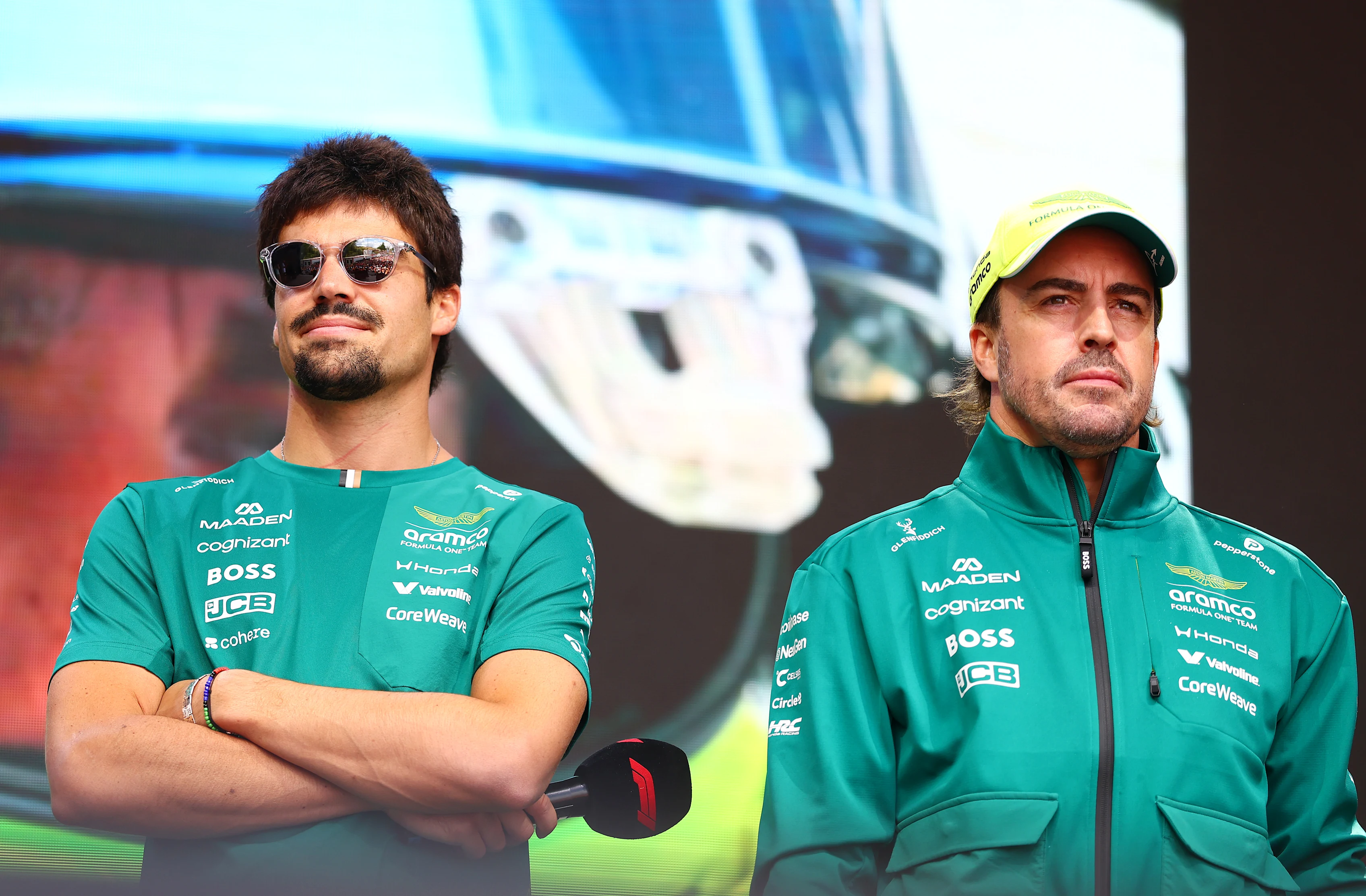 BUDAPEST, HUNGARY - JULY 24: Lance Stroll of Canada and Aston Martin F1 Team and Fernando Alonso of