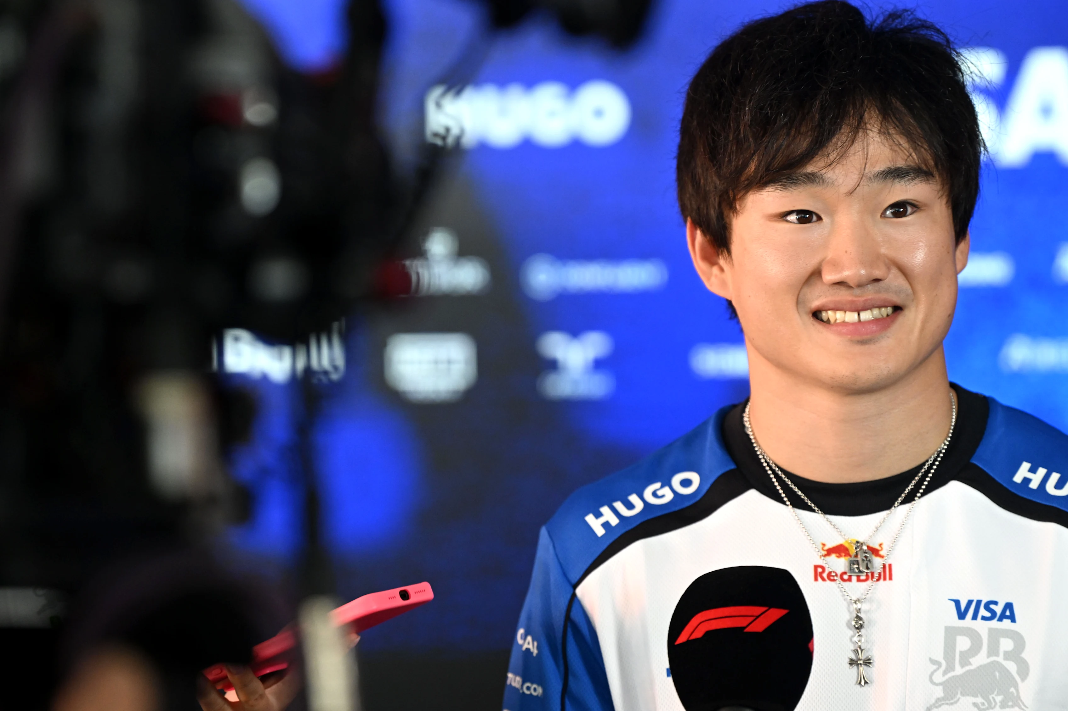 MONZA, ITALY - SEPTEMBER 03: Yuki Tsunoda of Japan and Visa Cash App Racing Bulls talks to the