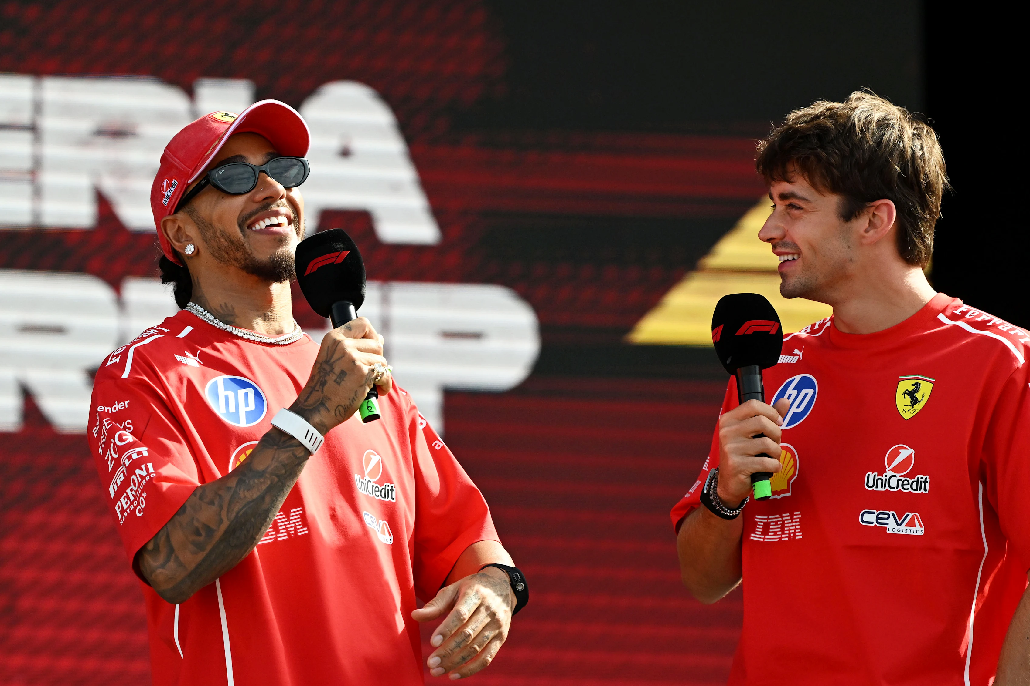 MONZA, ITALY - SEPTEMBER 05: Lewis Hamilton of Great Britain and Scuderia Ferrari and Charles