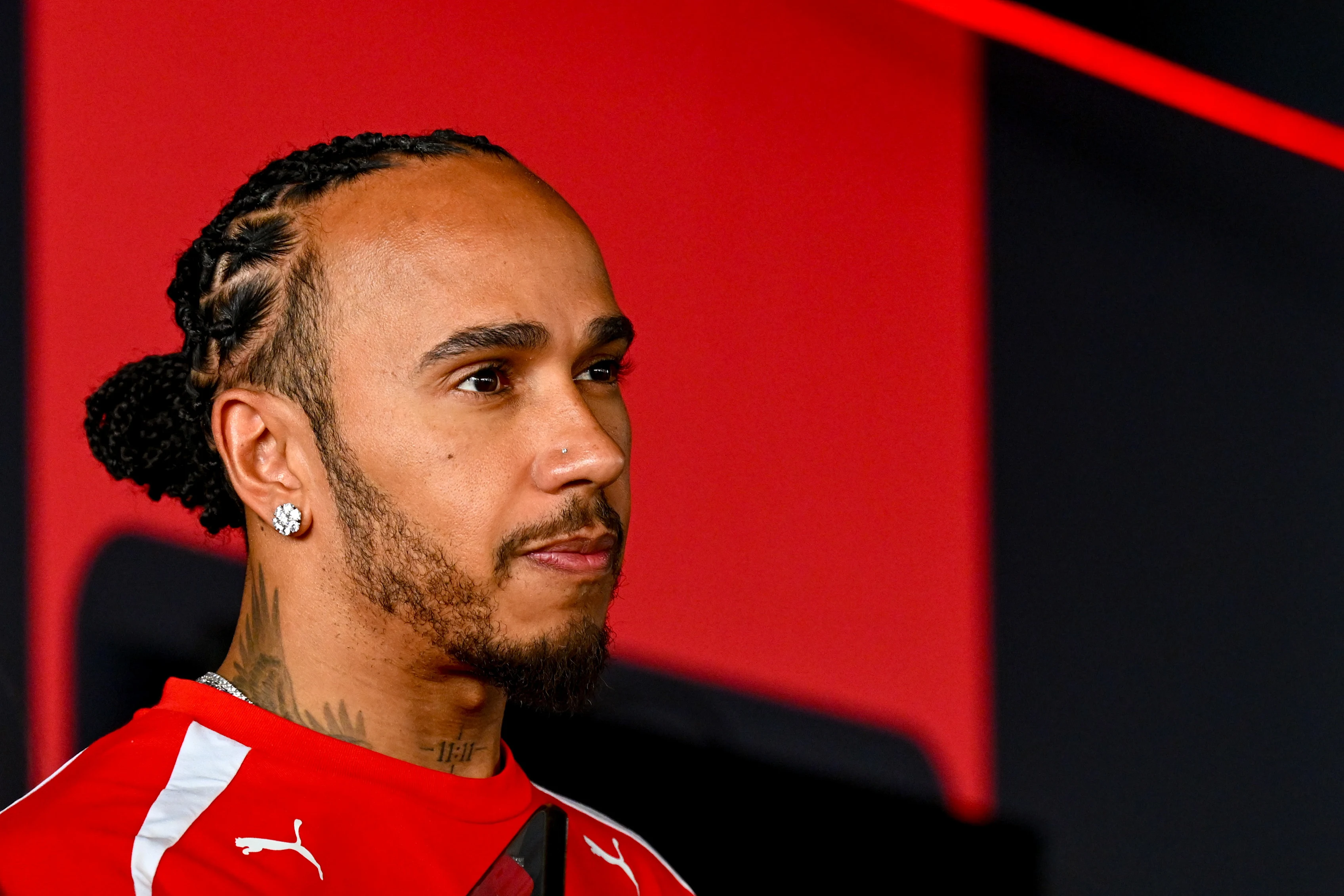 MEXICO CITY, MEXICO - OCTOBER 29: Lewis Hamilton of Great Britain and Scuderia Ferrari talks to the