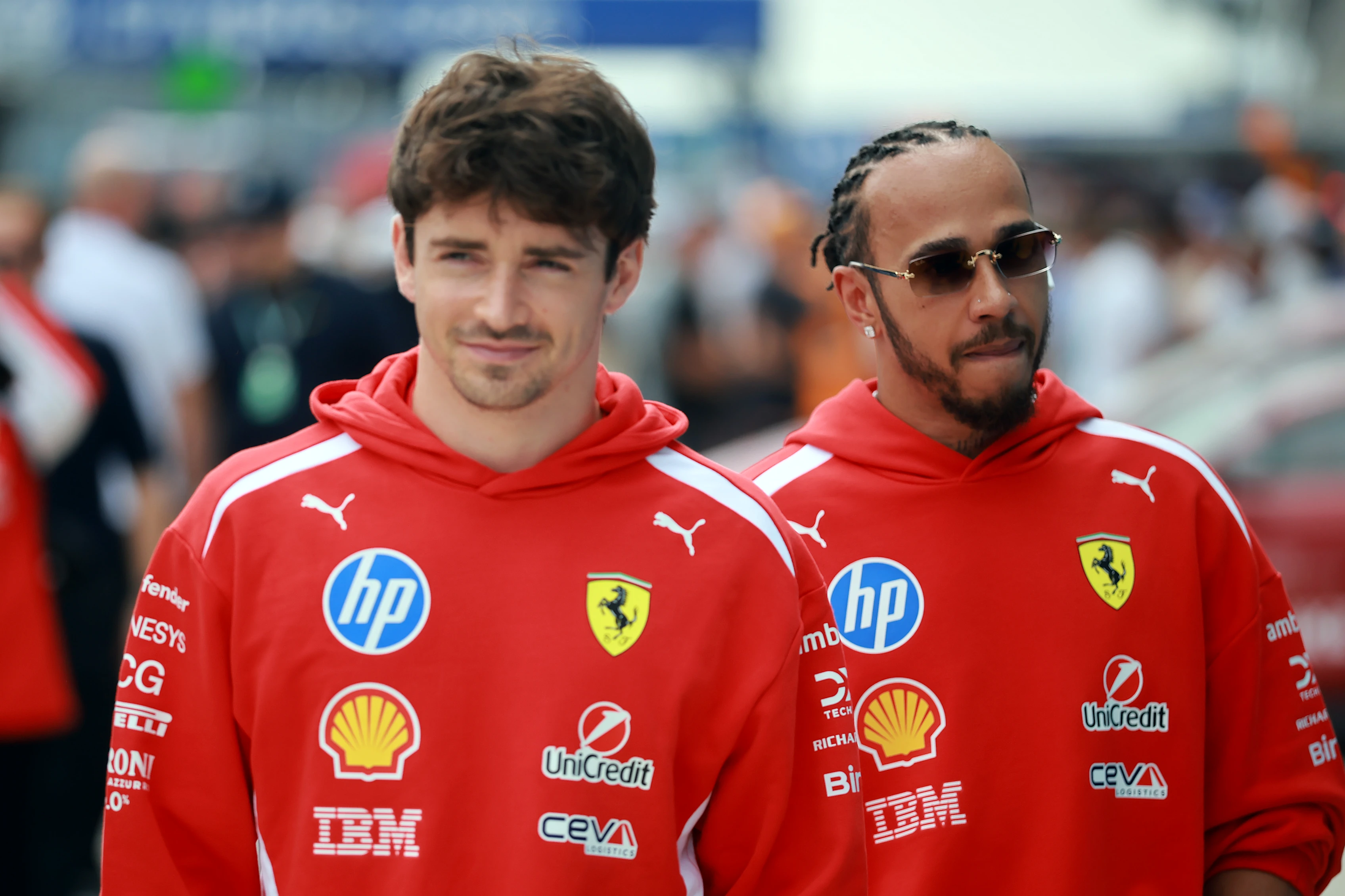 MIAMI, FLORIDA - MAY 03: Charles Leclerc of Monaco and Scuderia Ferrari and Lewis Hamilton of Great