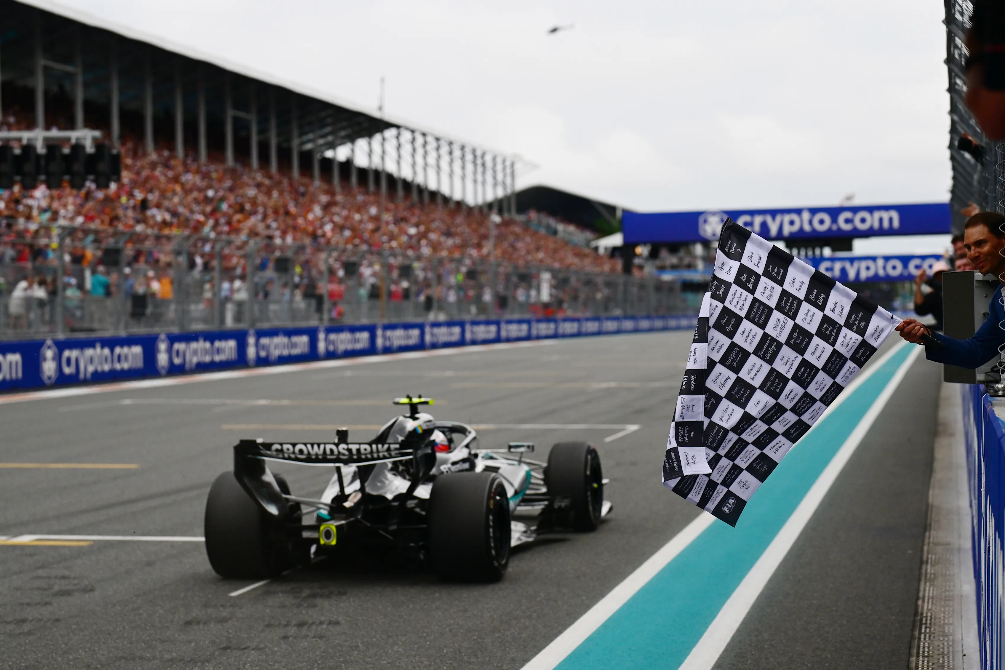 MIAMI, FLORIDA - MAY 03: Rafael Nadal waves the chequered flag for Race winner Andrea Kimi