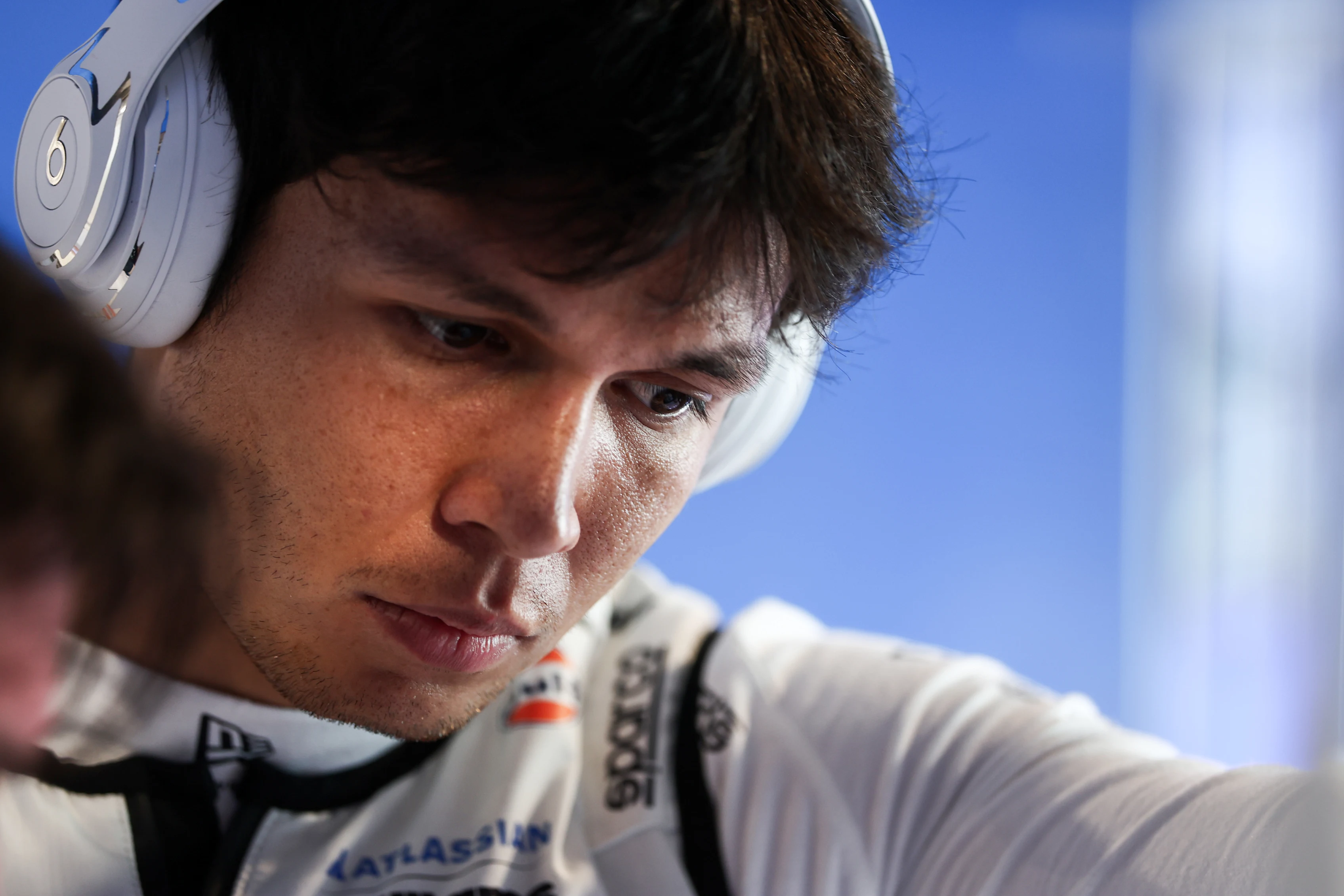 MIAMI, FLORIDA - MAY 02: Alexander Albon of Thailand and Williams looks on in the garage during