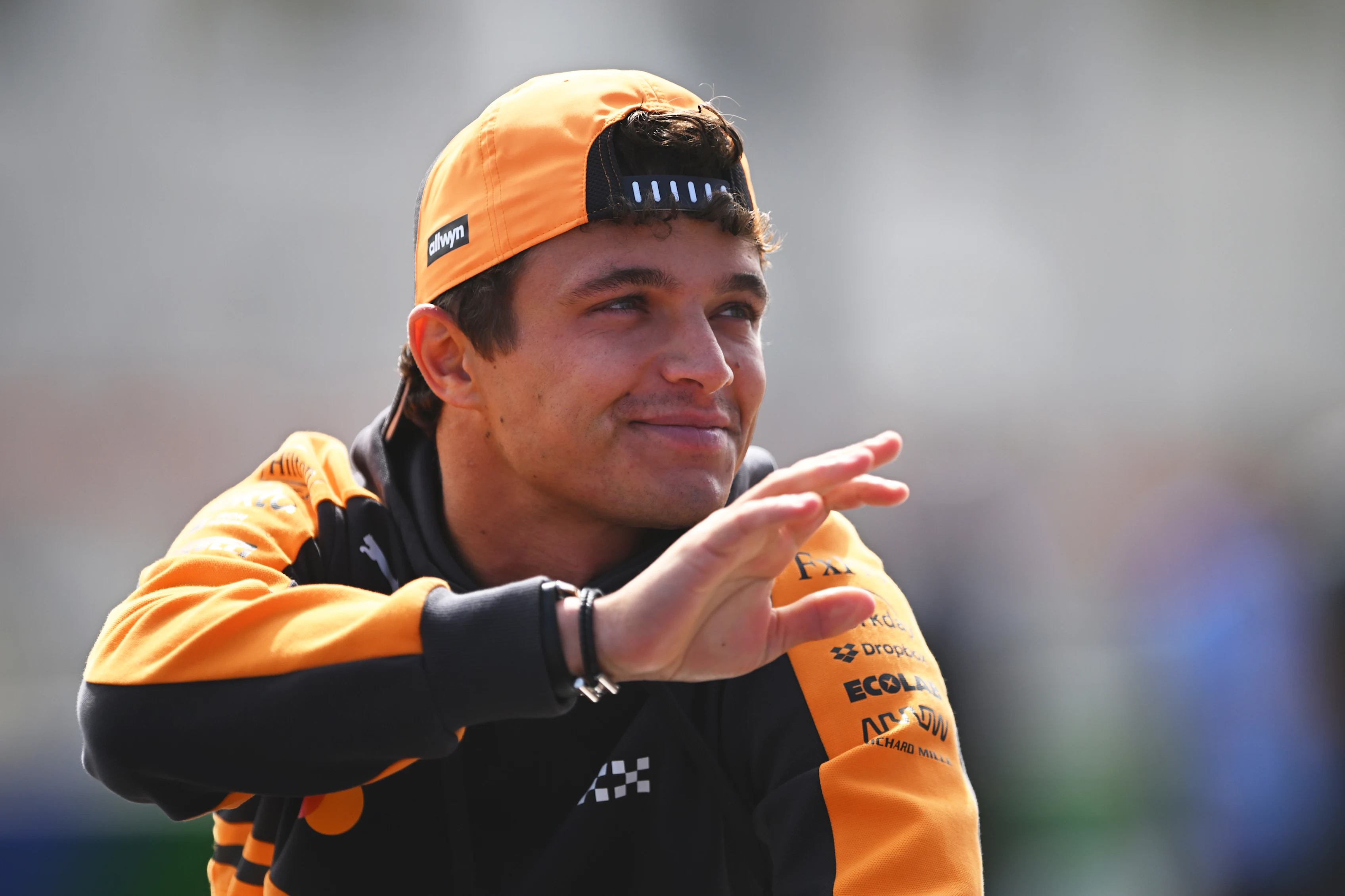 ZANDVOORT, NETHERLANDS - AUGUST 23: Lando Norris of Great Britain and McLaren waves on the drivers