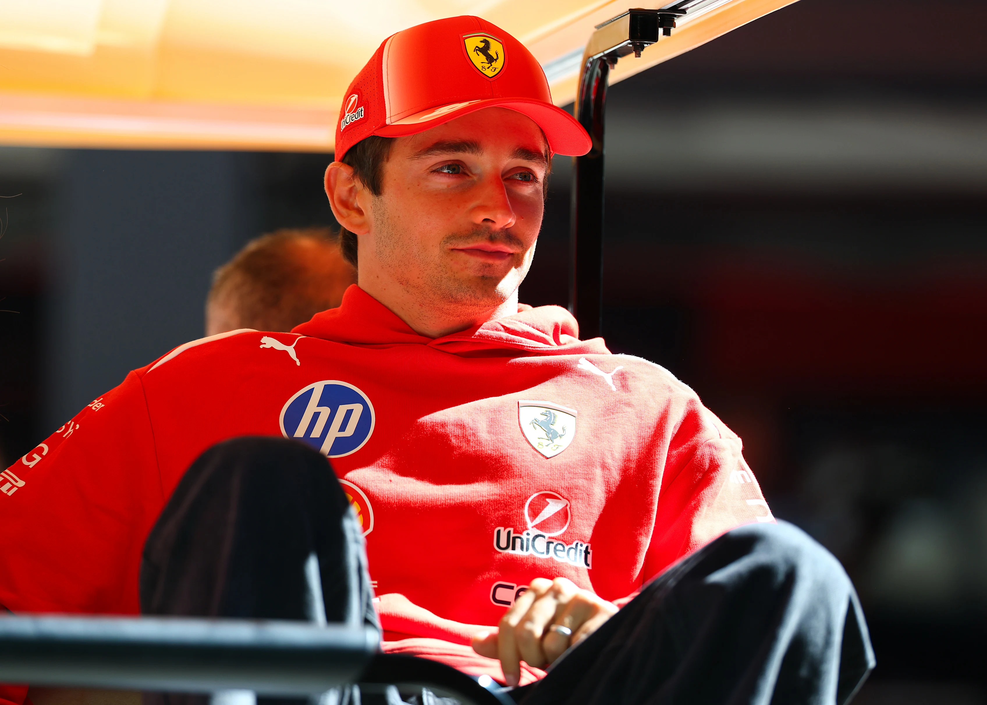 MADRID, SPAIN - SEPTEMBER 10: Charles Leclerc of Monaco and Scuderia Ferrari rides in the back of a
