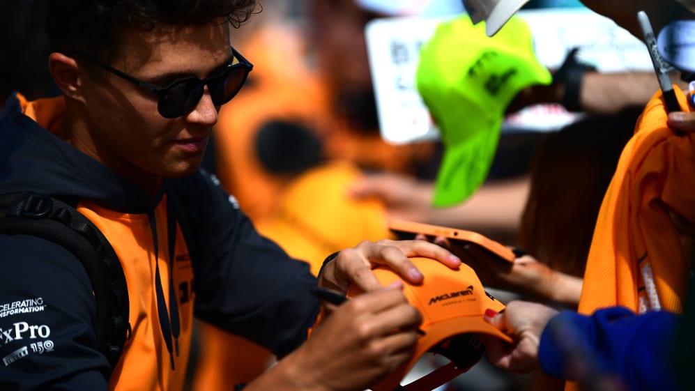 NORTHAMPTON, ENGLAND - JULY 03: Lando Norris of Great Britain and McLaren greets fans as he arrives