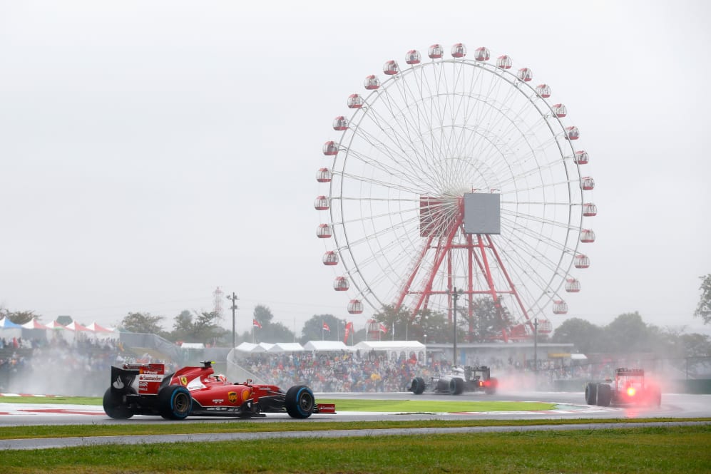 SUZUKA, JAPAN - OCTOBER 05: Kimi Raikkonen of Finland and Ferrari drives during the Japanese