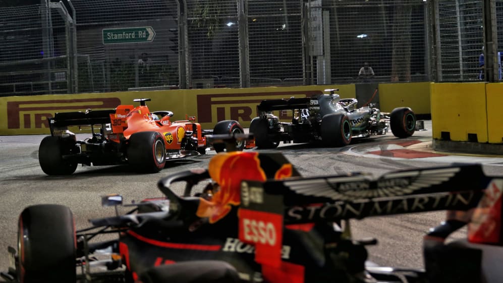 Lewis Hamilton (GBR) Mercedes AMG F1 W10 leads Sebastian Vettel (GER) Ferrari SF90 and Max