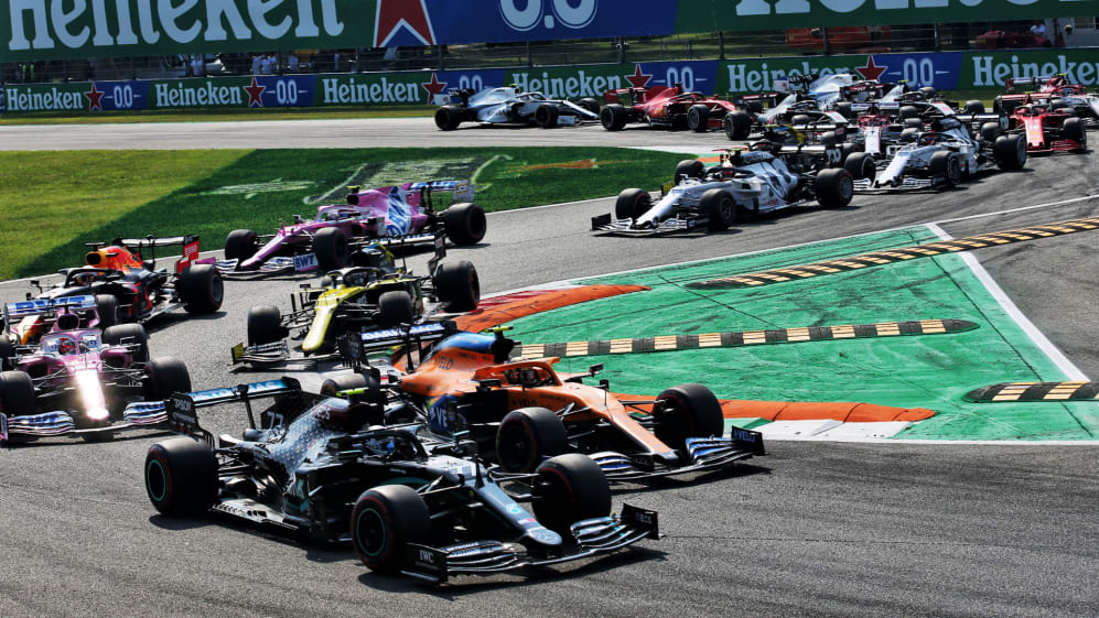 Valtteri Bottas (FIN) Mercedes AMG F1 W11 and Carlos Sainz Jr (ESP) McLaren MCL35 at the start of