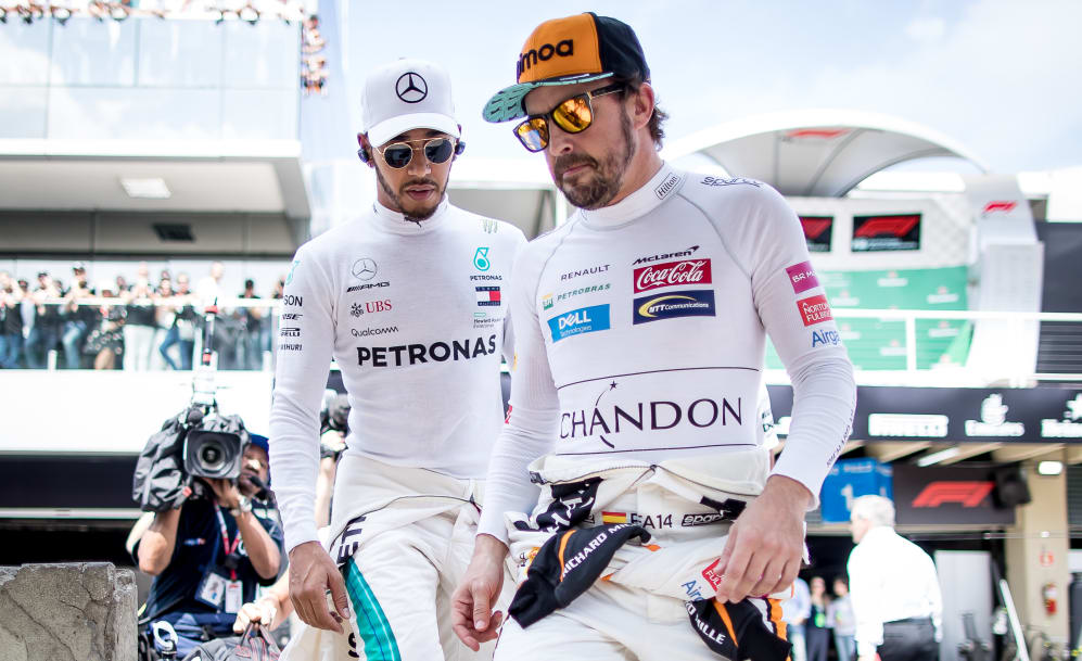 SAO PAULO, BRAZIL - NOVEMBER 11: Fernando Alonso of Spain and McLaren F1 and Lewis Hamilton of