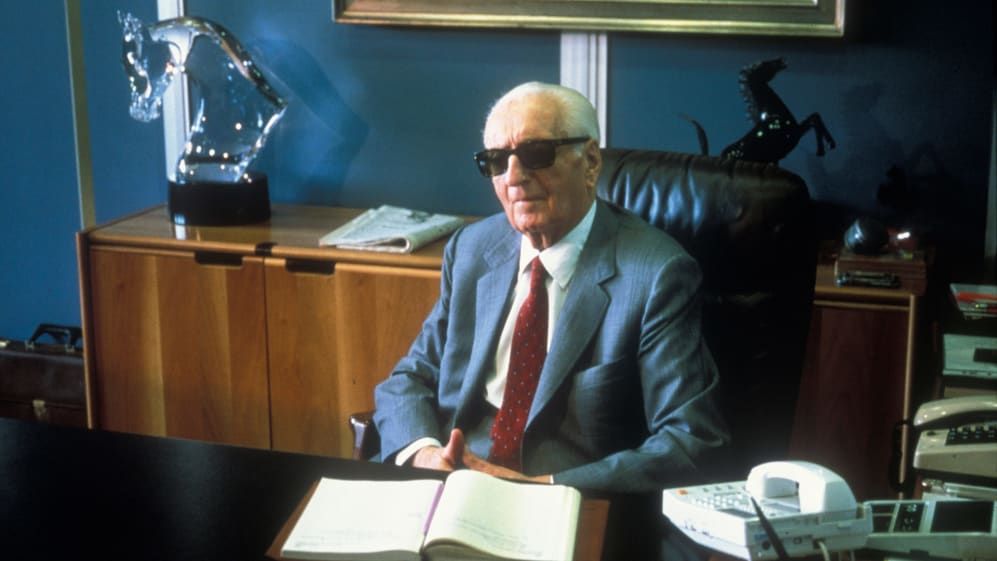 Enzo Ferrari the founder of the Scuderia Ferrari Grand Prix motor racing team sits at his office