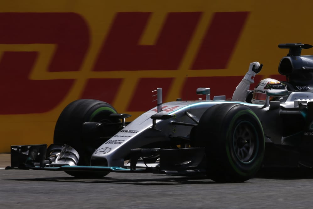 NORTHAMPTON, ENGLAND - JULY 05: Lewis Hamilton of Great Britain and Mercedes GP celebrates victory