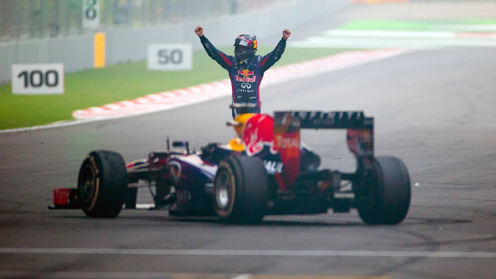 Red Bull driver Sebastian Vettel of Germany celebrates on his car