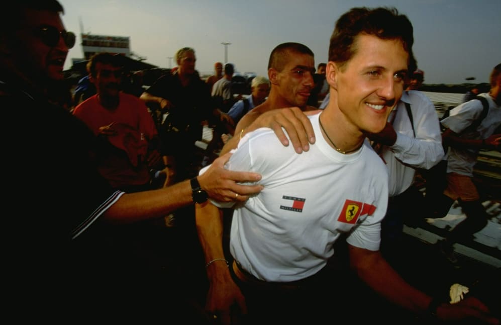 14-16 Aug 1998: Ferrari driver Michael Schumacher of Germany is congratulated on his win in the