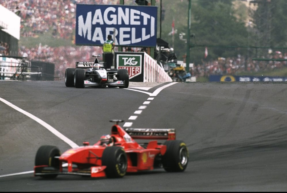 14-16 Aug 1998: Ferrari driver Michael Schumacher of Germany goes into the lead as