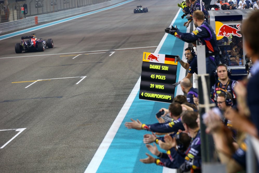 ABU DHABI, UNITED ARAB EMIRATES - NOVEMBER 23: Members of the Infiniti Red Bull Racing team cheer