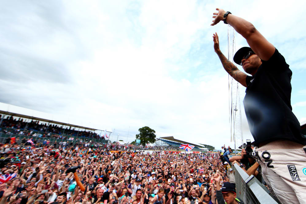 NORTHAMPTON, ENGLAND - JULY 05: Lewis Hamilton of Great Britain and Mercedes GP celebrates with