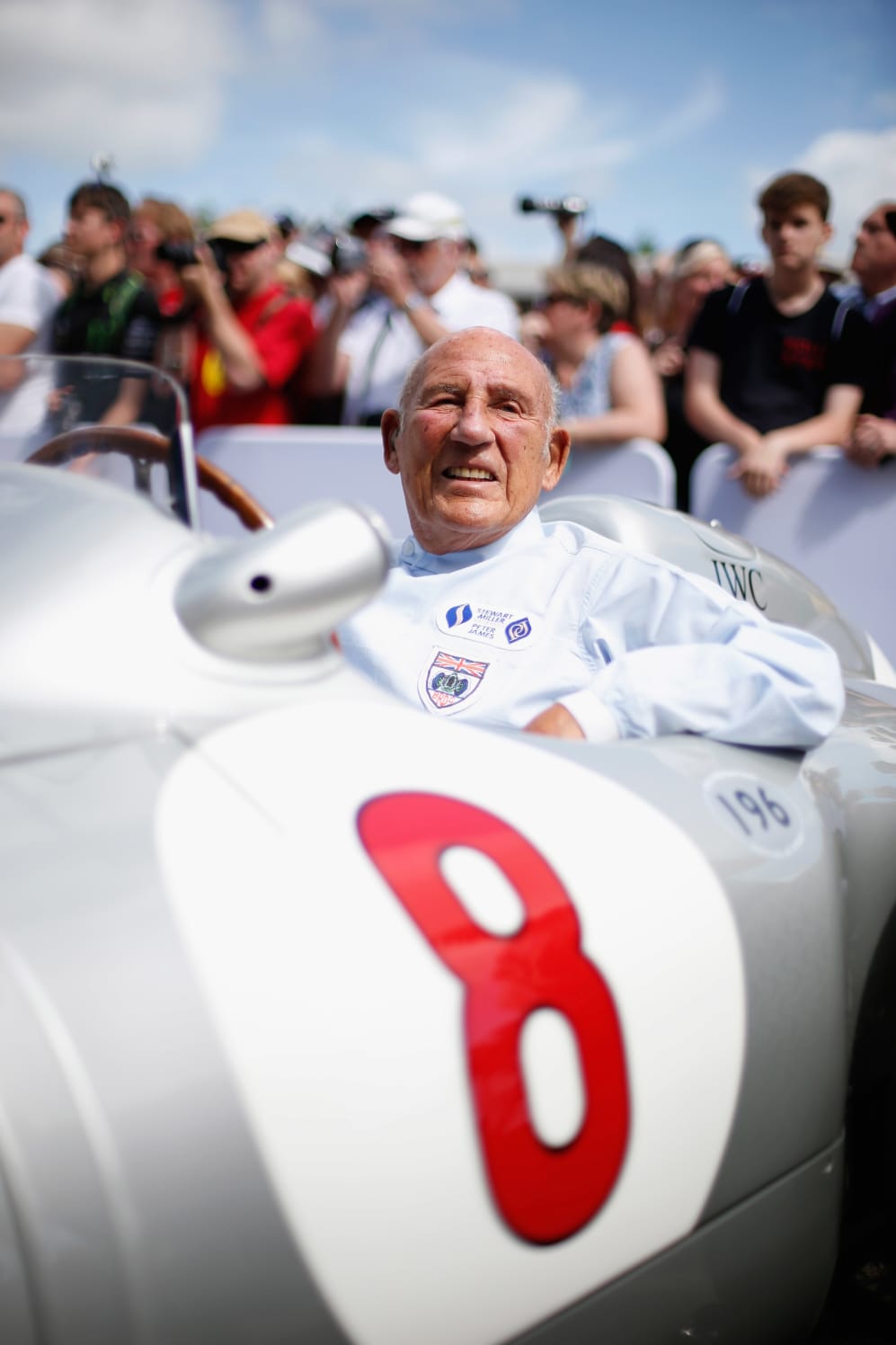 CHICHESTER, ENGLAND - JUNE 27: Sir Stirling Moss sitting in his Mercedes before driving up the