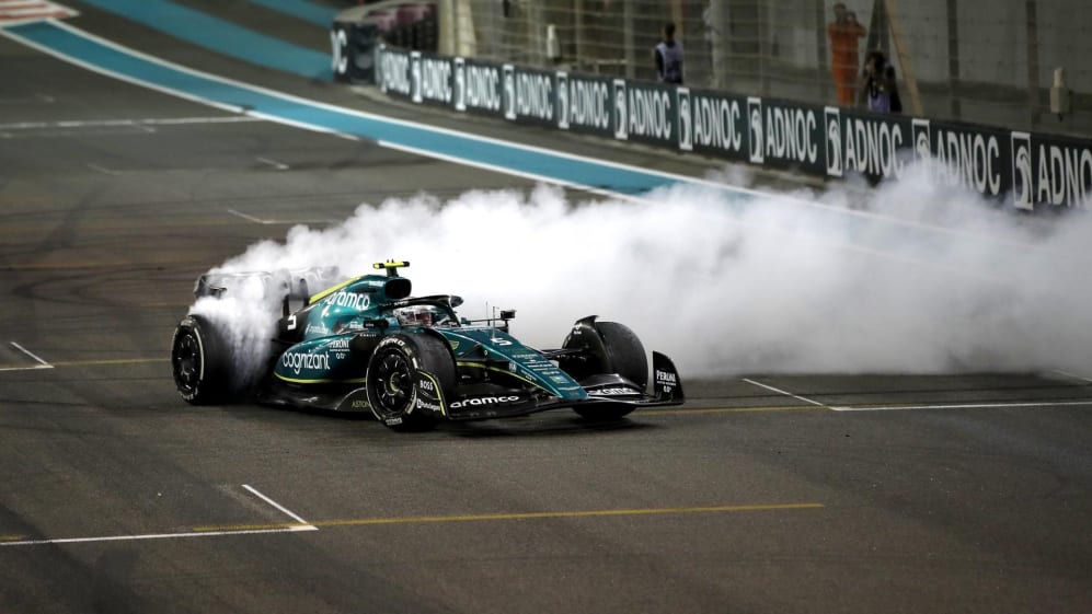 Sebastian Vettel, Aston Martin AMR22, performs donuts on the grid at the end of the race in Abu Dhabi 2022