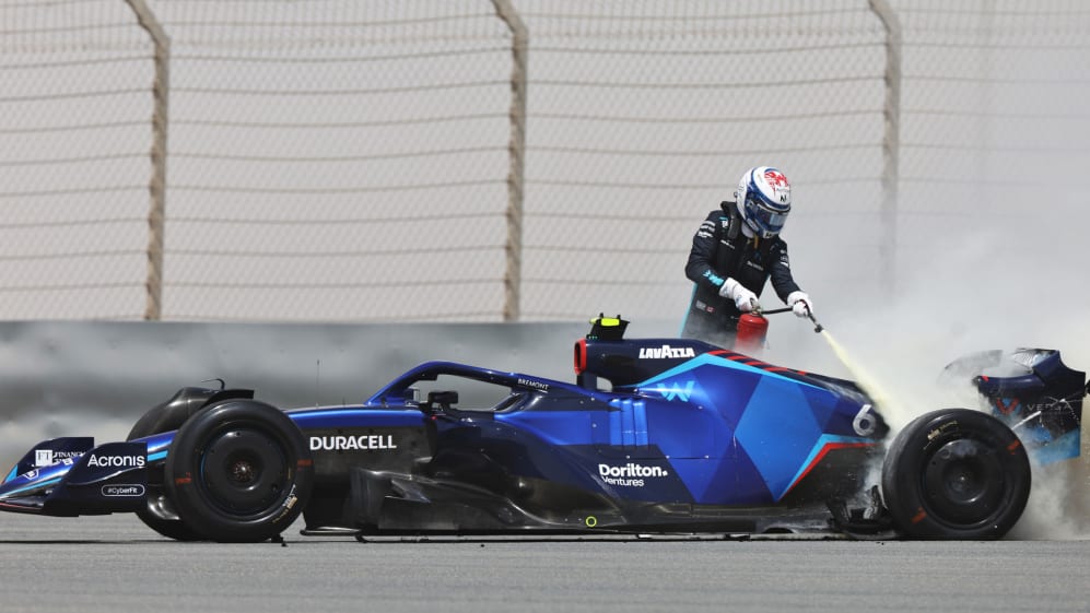 Nicholas Latifi putting out a fire during 2022 F1 Official Pre-Season Test
