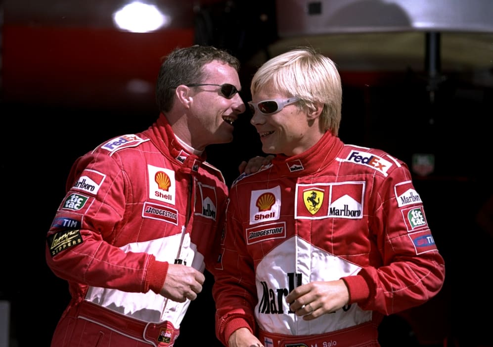 25 Jul 1999: Ferrari's Eddie Irvine shares a joke with new team mate Mika Salo before the Formula