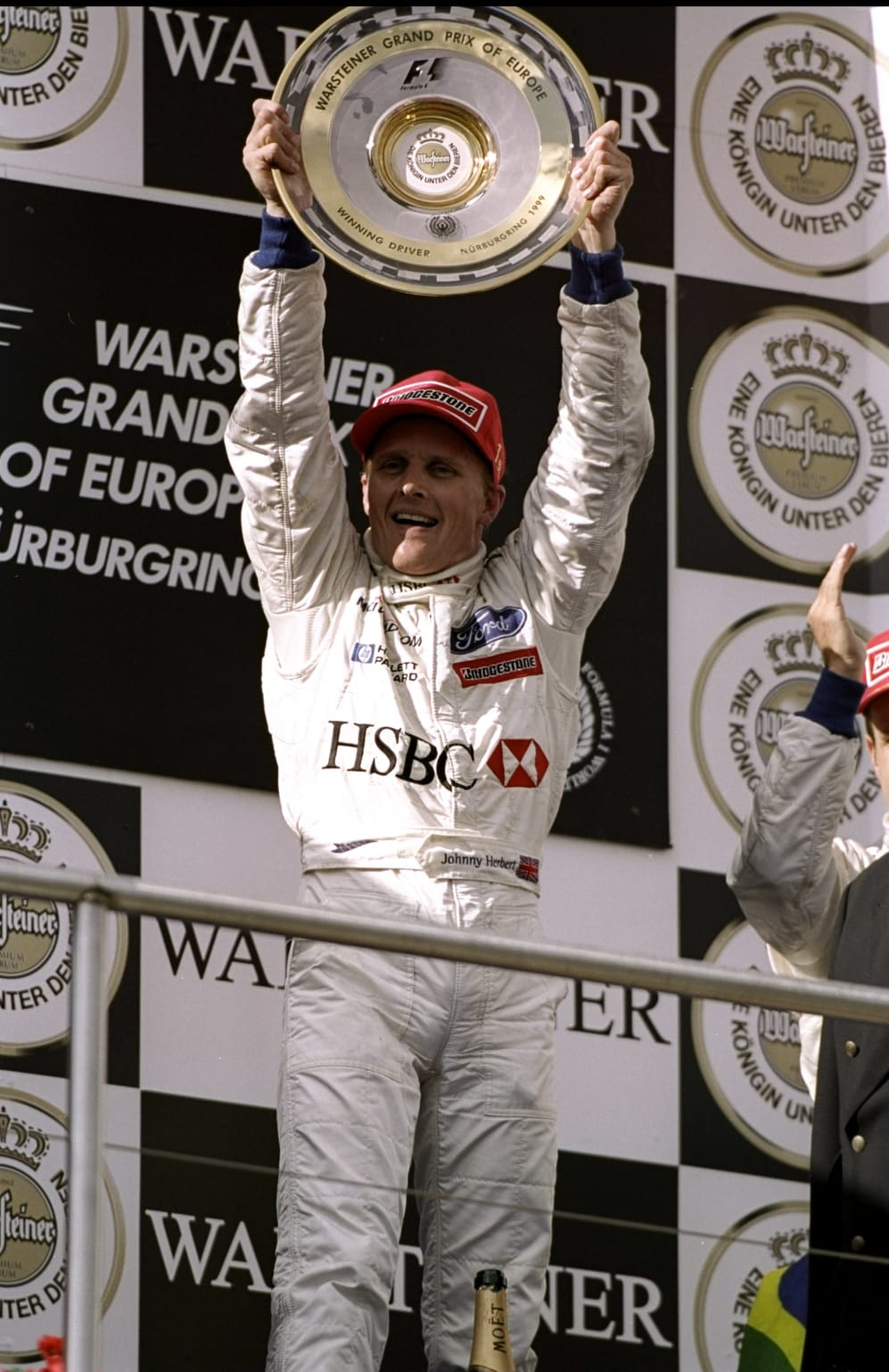 26 Sep 1999: Johnny Herbert of Great Britain and Stewart Ford celebrates winning the European