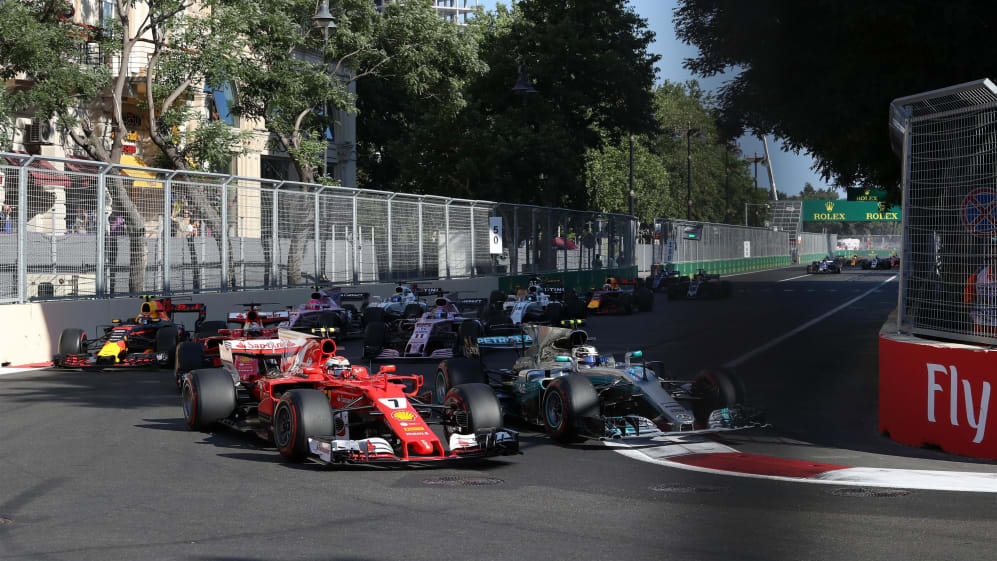 Valtteri Bottas (FIN) Mercedes-Benz F1 W08 Hybrid and Kimi Raikkonen (FIN) Ferrari SF70-H batte at