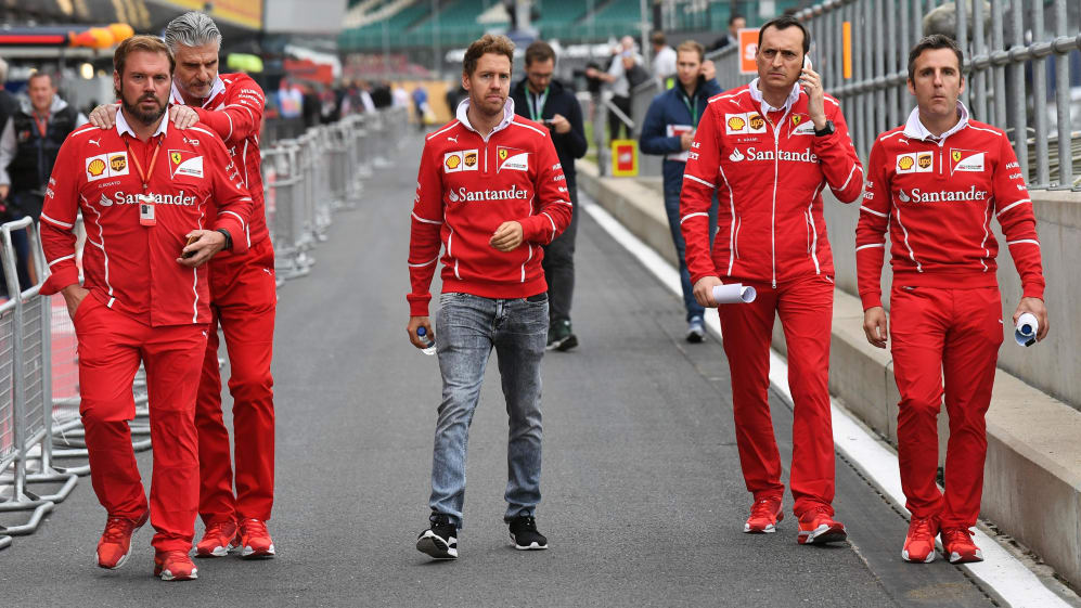 Sebastian Vettel (GER) Ferrari walsk the track with Maurizio Arrivabene (ITA) Ferrari Team