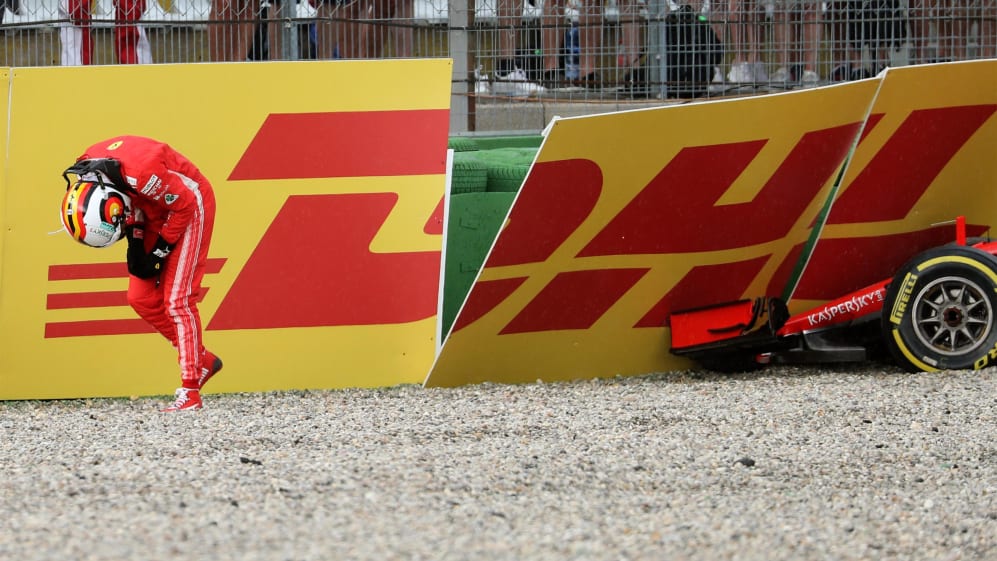 Sebastian Vettel (GER) Ferrari SF-71H walks in after crashing out of the race at Formula One World