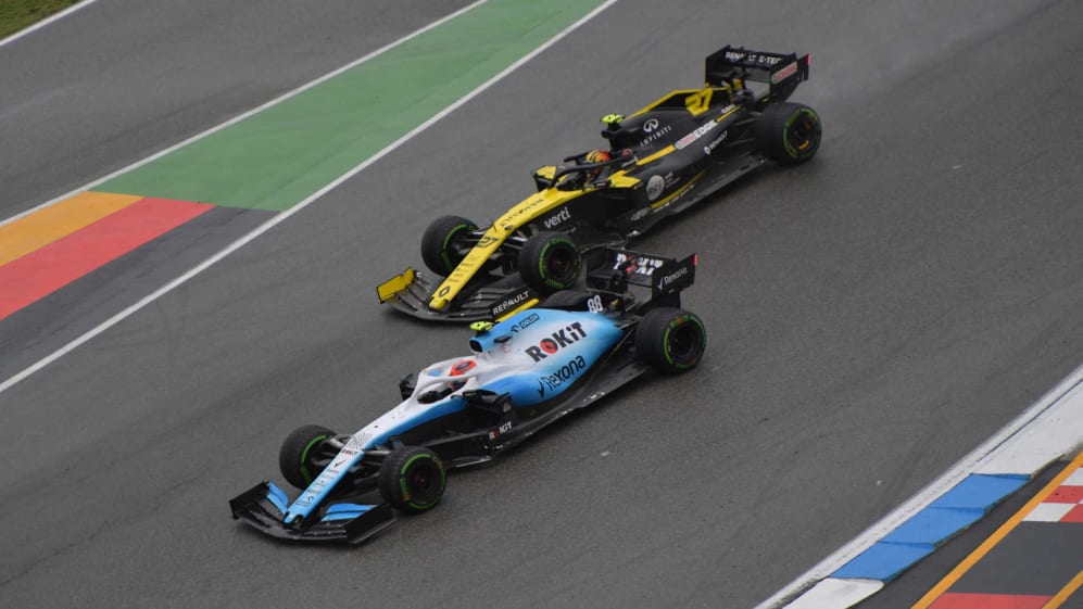 HOCKENHEIMRING, GERMANY - JULY 28: Robert Kubica, Williams FW42, battles with Nico Hulkenberg,