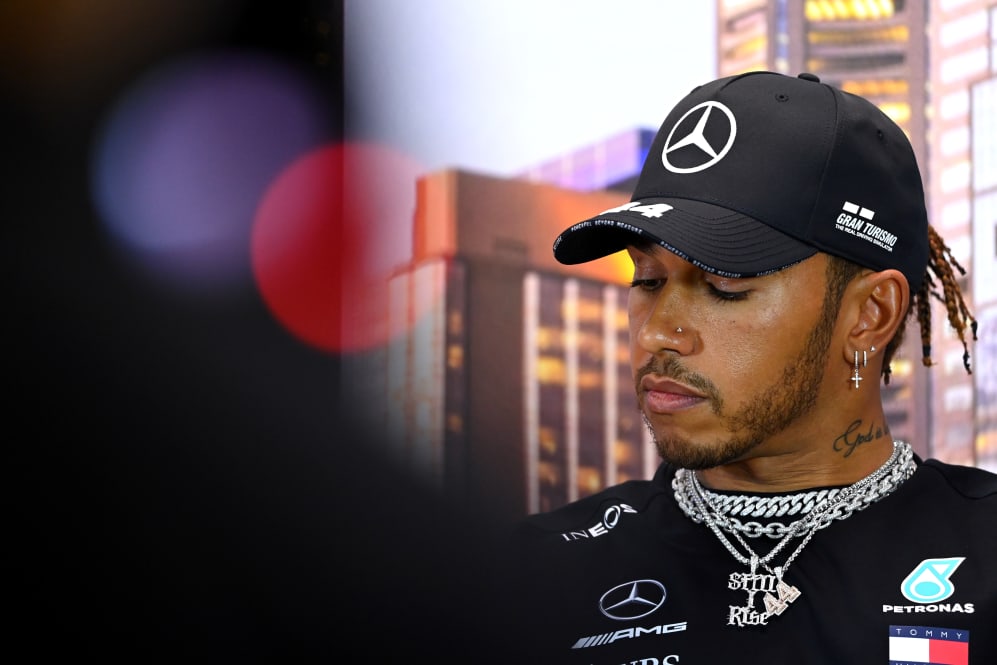 MELBOURNE, AUSTRALIA - MARCH 12: Lewis Hamilton of Great Britain and Mercedes GP looks on during a
