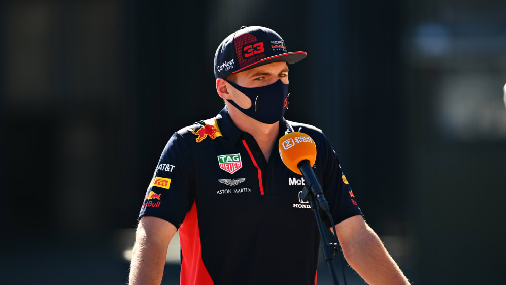 NORTHAMPTON, ENGLAND - JULY 30: Max Verstappen of Netherlands and Red Bull Racing talks to the