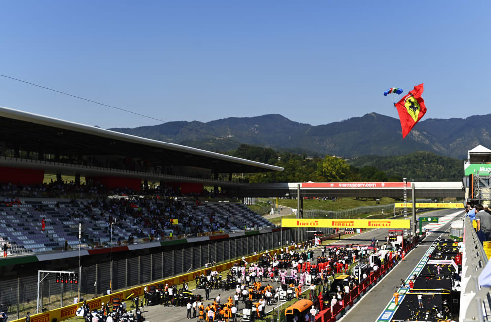 SCARPERIA, ITALY - SEPTEMBER 13: A parachutist flies with a Ferrari flag before the F1 Grand Prix