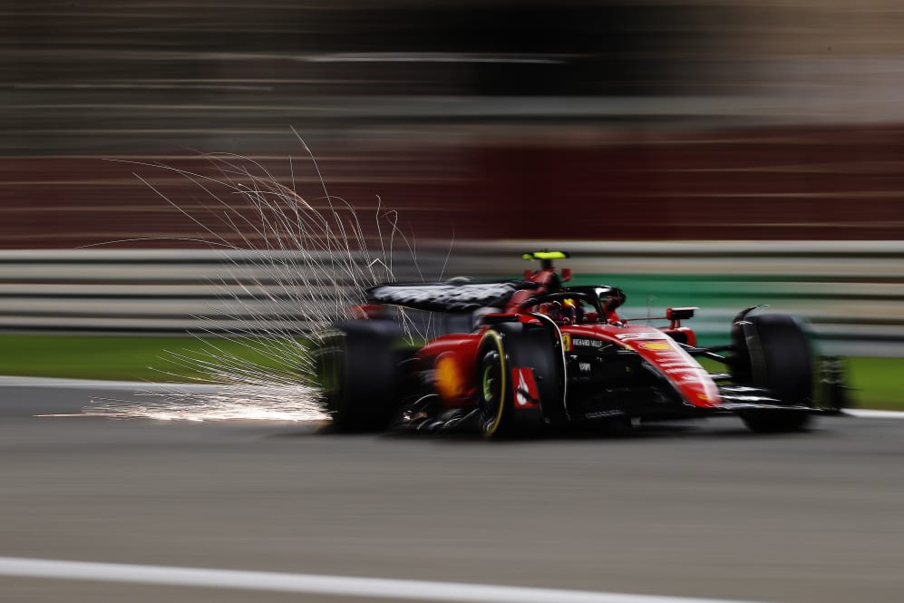 BAHRAIN, BAHRAIN - FEBRUARY 25: Sparks fly behind Carlos Sainz of Spain driving (55) the Ferrari