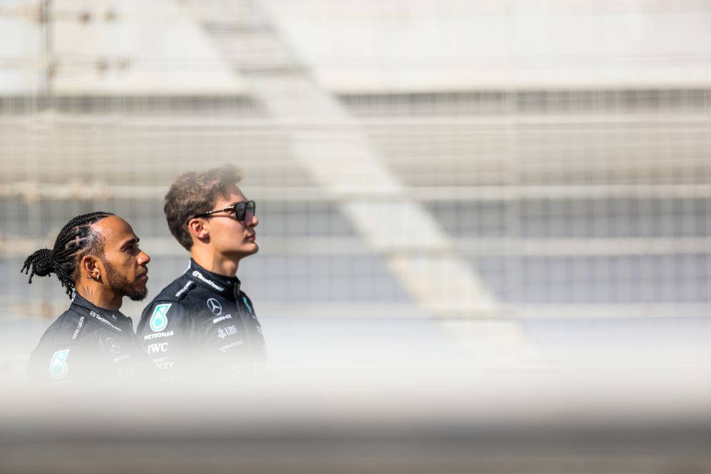 BAHRAIN, BAHRAIN - FEBRUARY 23: Lewis Hamilton of Mercedes and Great Britain and George Russell of