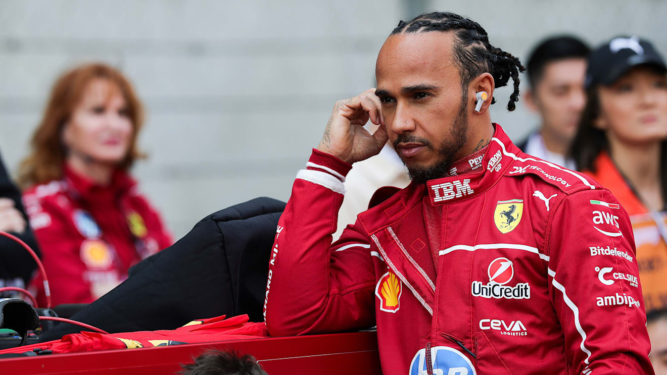 SHANGHAI, CHINA - MARCH 22: Lewis Hamilton of Great Britain and Scuderia Ferrari on the grid during