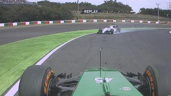 Caterham's Roberto Merhi finds himself facing the wrong direction after spinning at Spoon Curve, prompting Williams' Valtteri Bottas to take evasive action © FOWC Ltd